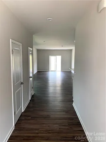 a view of gallery with wooden floor