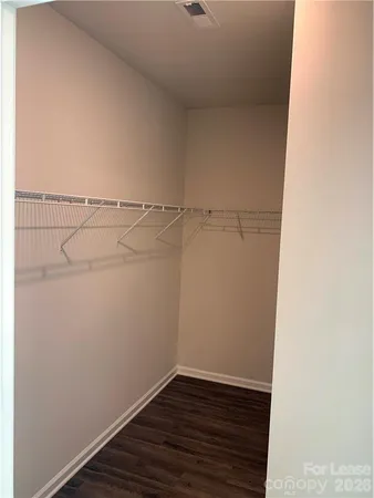 a view of a room with racks on the wall