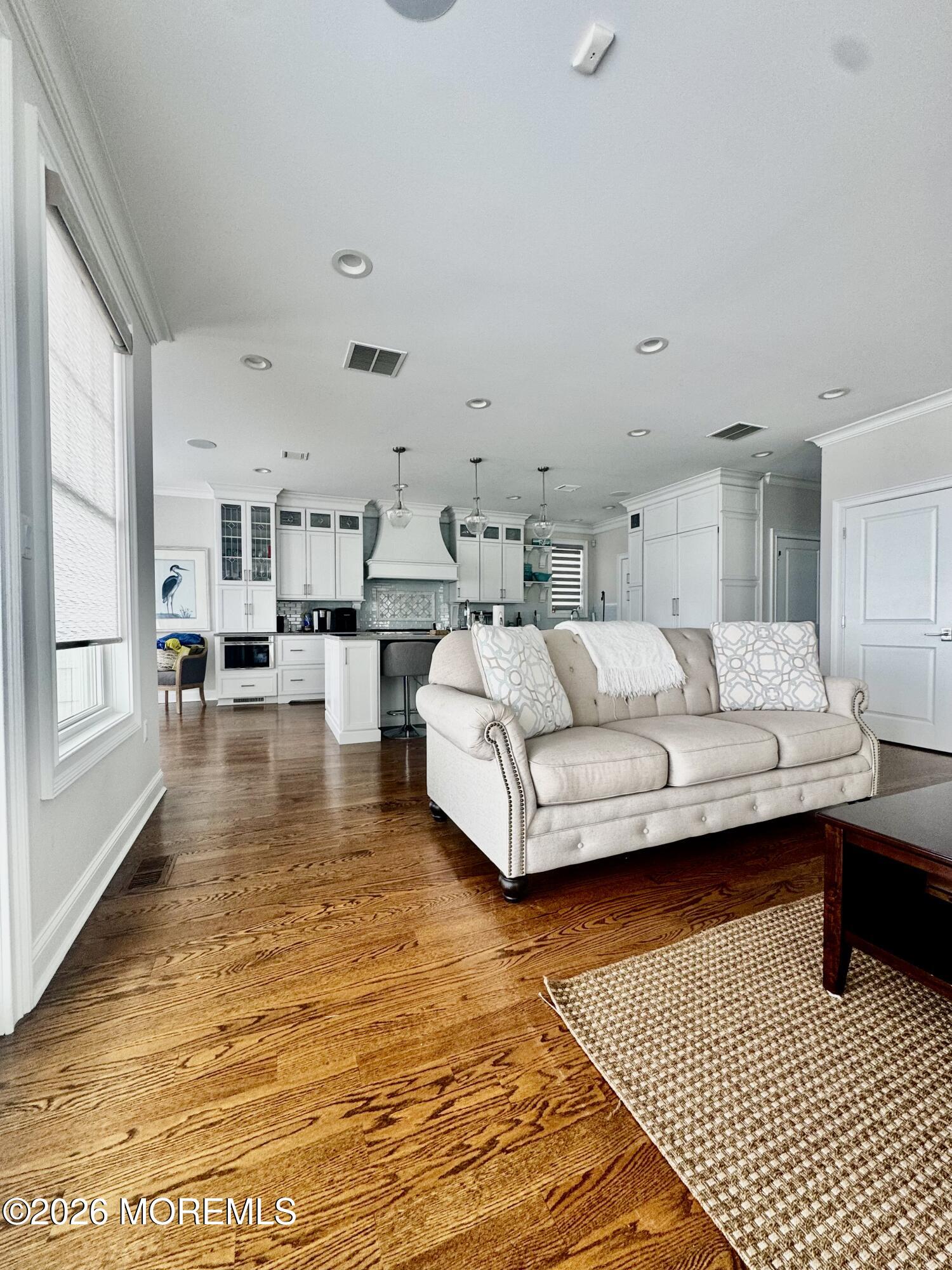 79 Pershing Boulevard Lavallette, NJ 08735 - Photo 3 of 11 a living room with furniture and a table