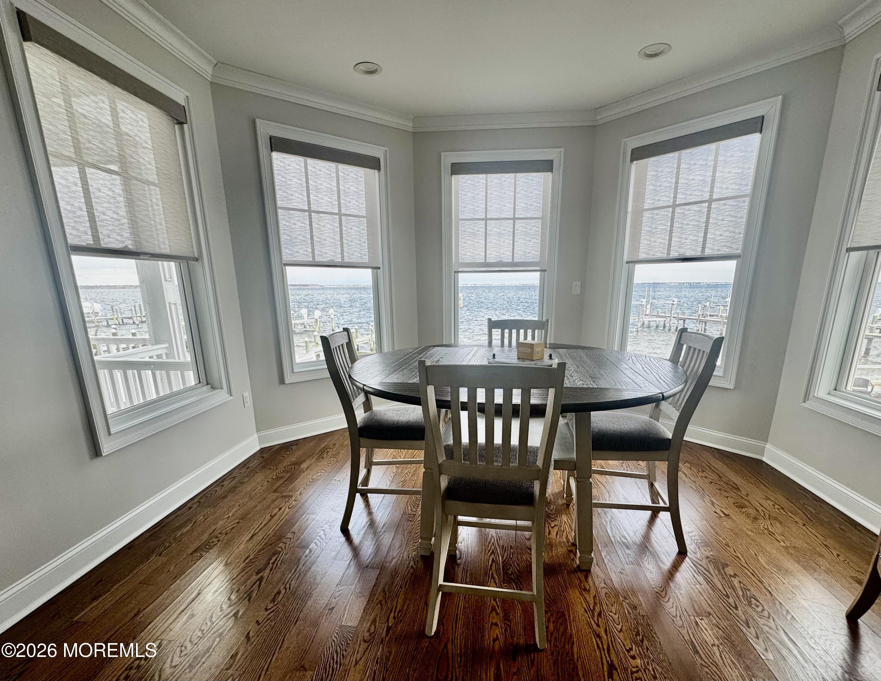 79 Pershing Boulevard Lavallette, NJ 08735 - Photo 4 of 11 a view of a dining room with furniture and wooden floor