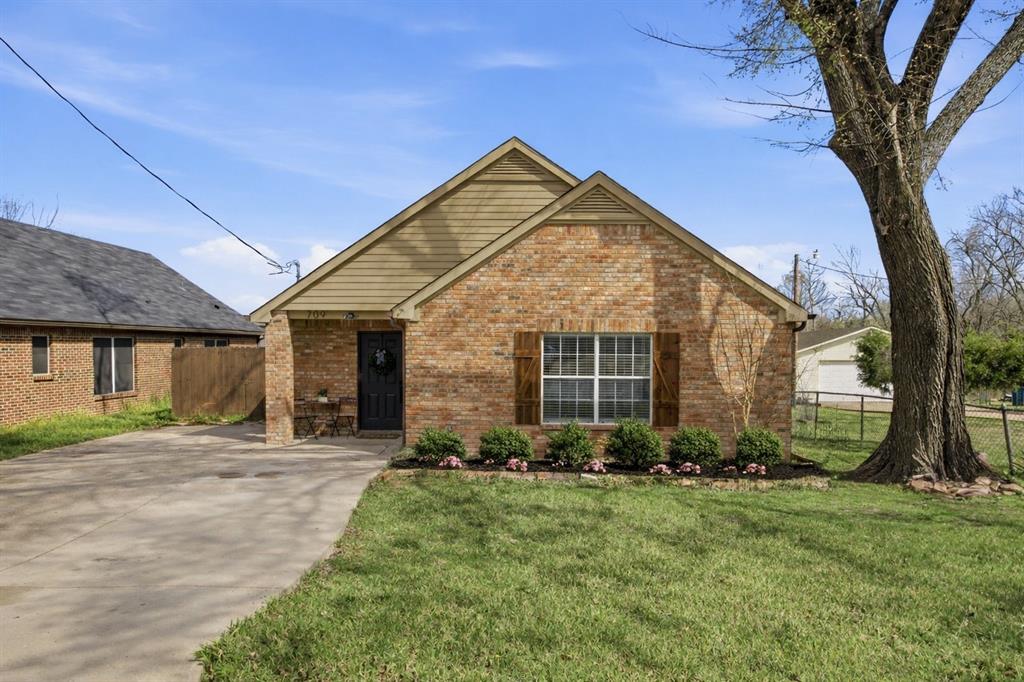 709 Sherman Street Rockwall, TX 75087 - Photo 15 of 23 a view of a house next to a yard