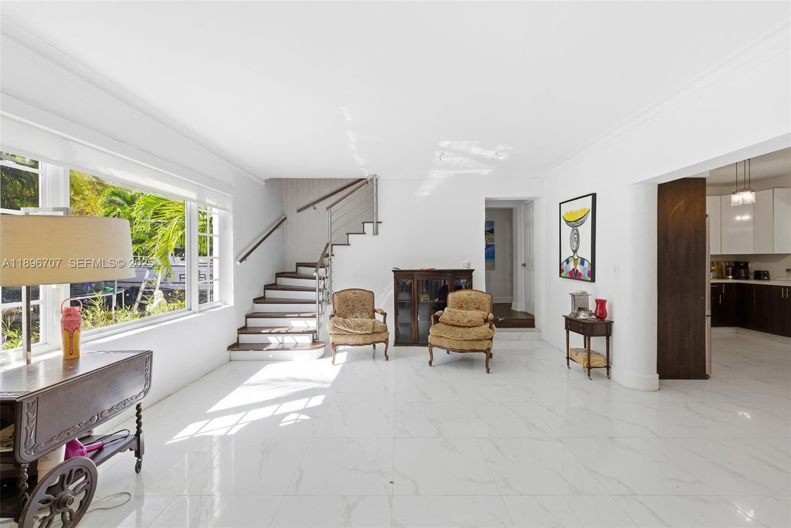 401 Southwest 28th Road Miami, FL 33129 - Photo 12 of 45 a living room with furniture and stairs