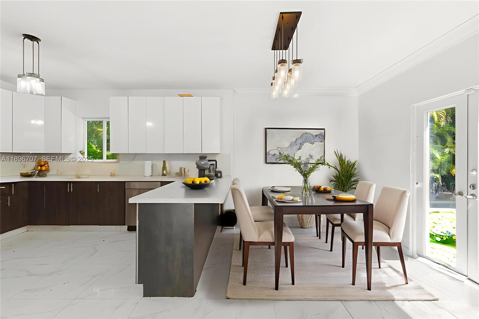 401 Southwest 28th Road Miami, FL 33129 - Photo 15 of 45 a kitchen with a table and chairs in it