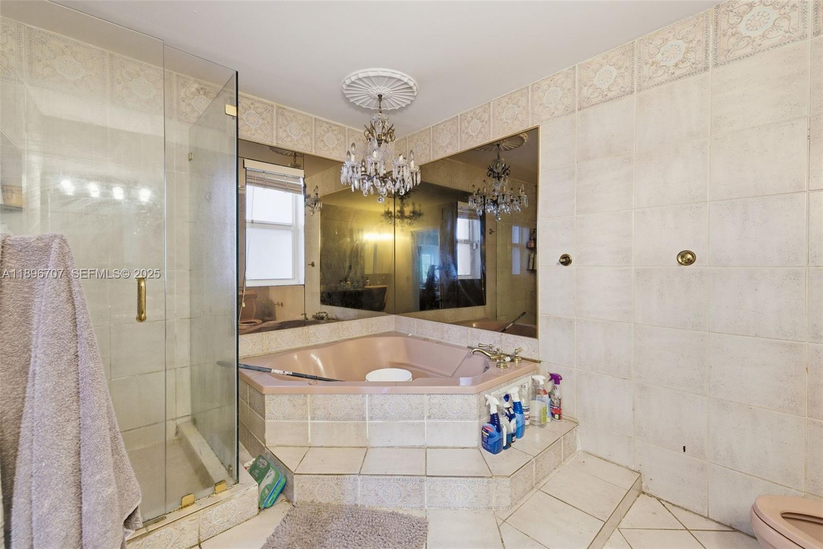 401 Southwest 28th Road Miami, FL 33129 - Photo 20 of 45 a spacious bathroom with a tub sink and mirror