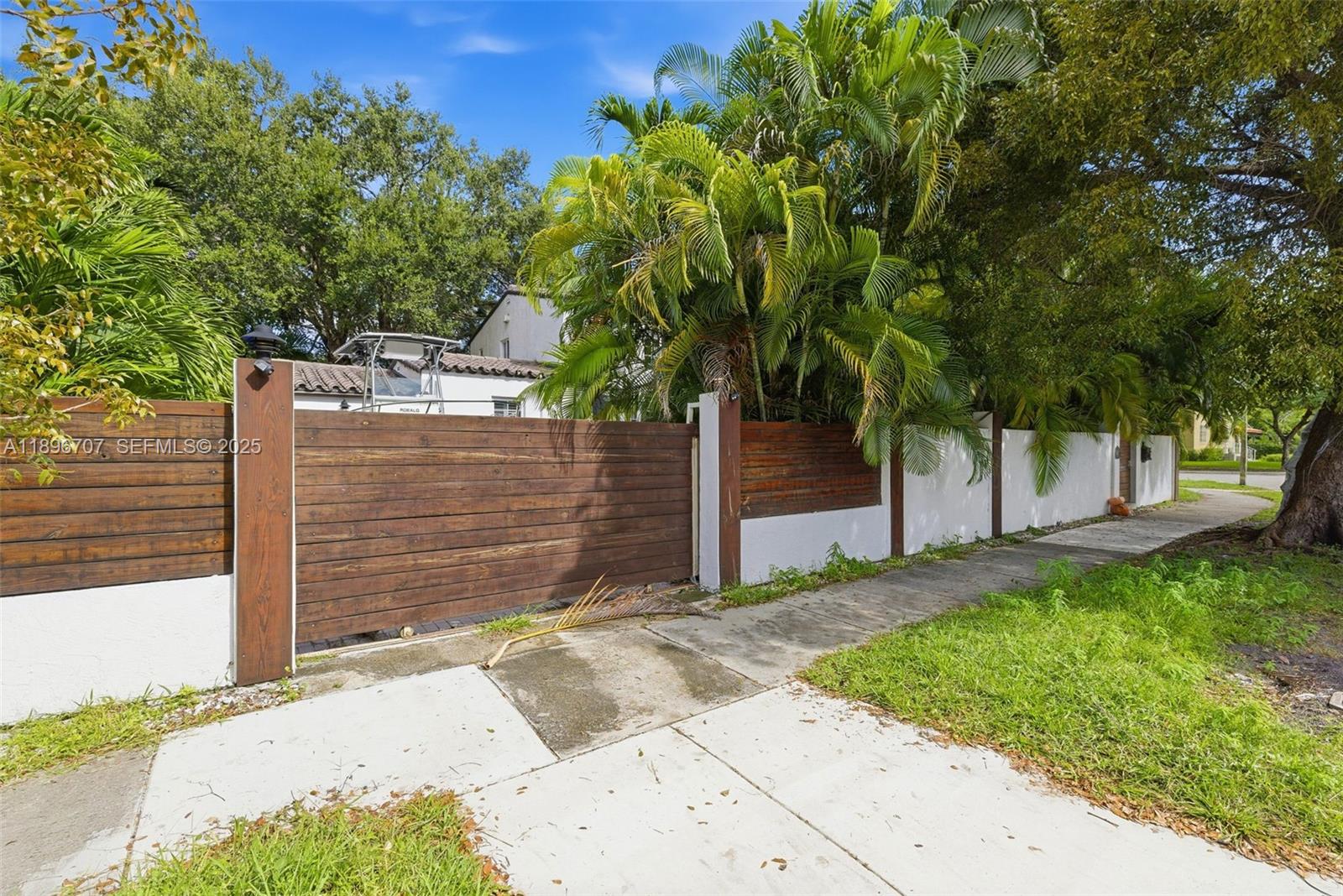 401 Southwest 28th Road Miami, FL 33129 - Photo 24 of 45 a view of a back yard of the house and tree