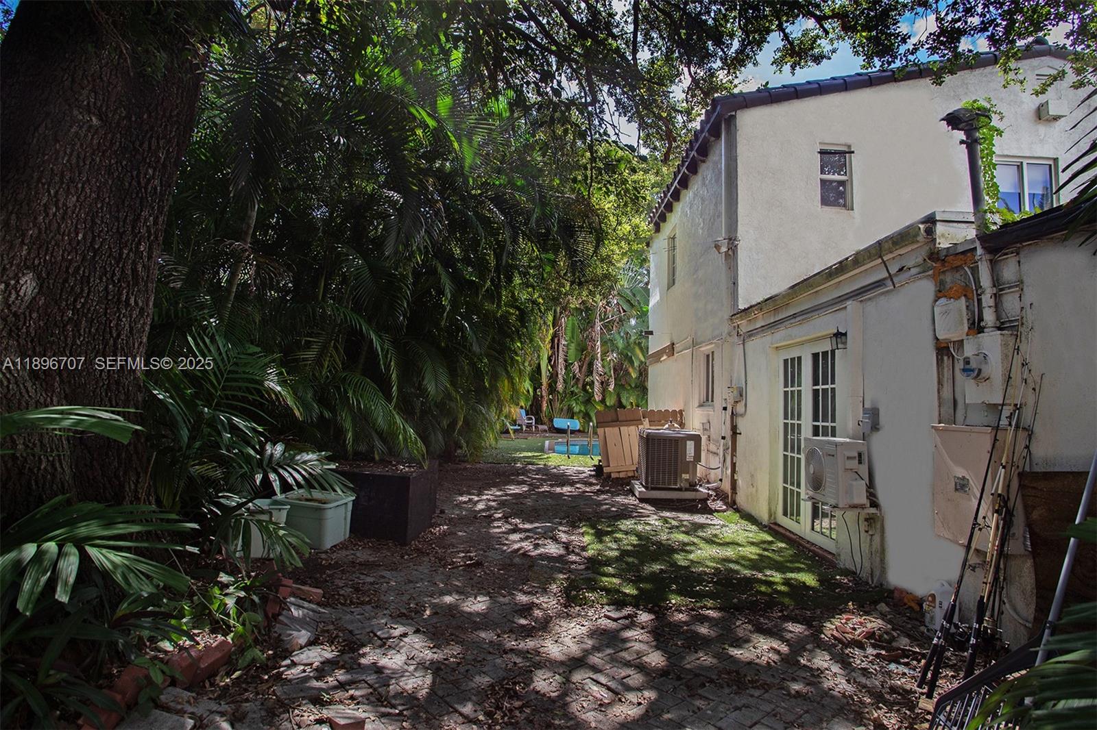401 Southwest 28th Road Miami, FL 33129 - Photo 29 of 45 a view of a house with backyard and sitting area