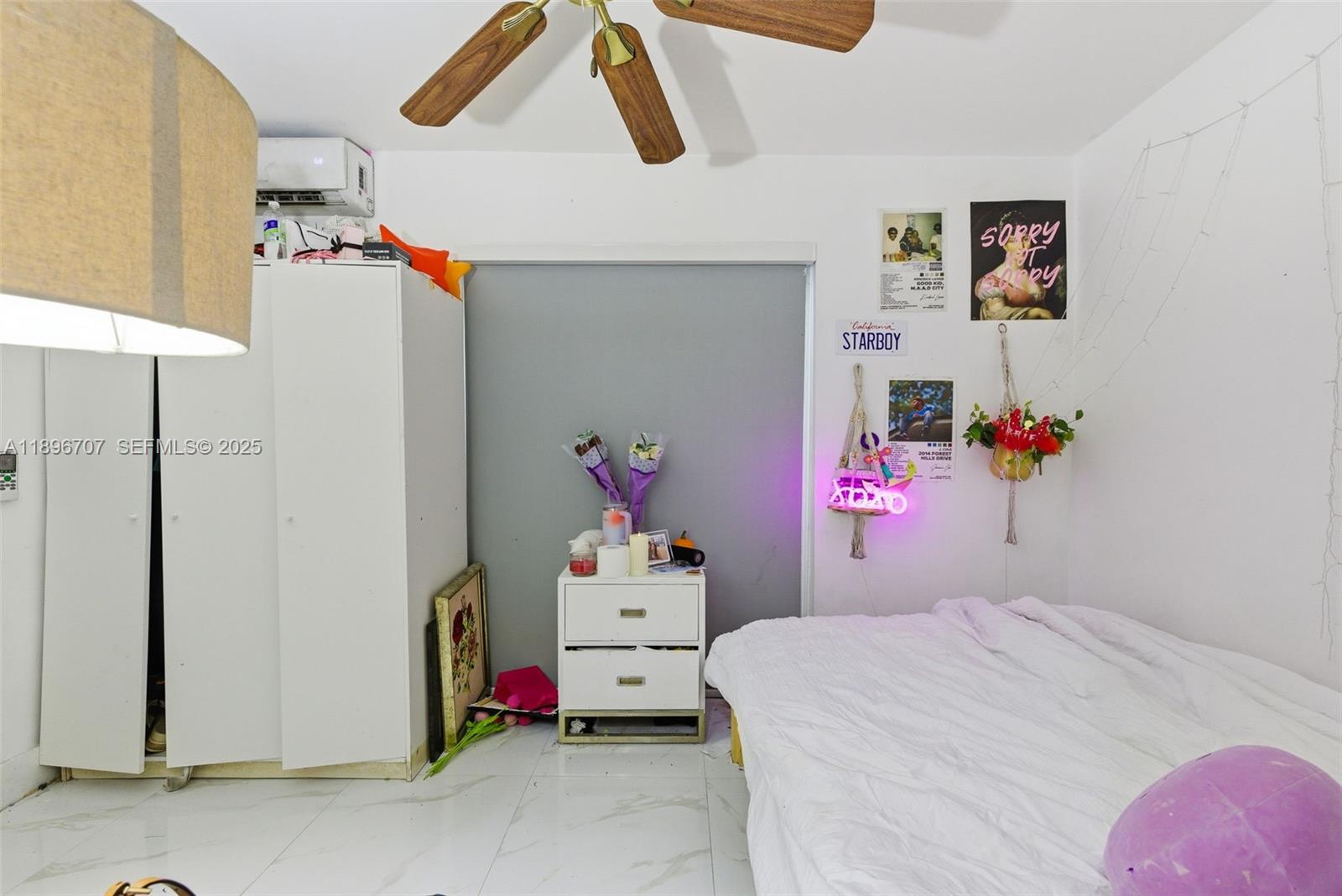 401 Southwest 28th Road Miami, FL 33129 - Photo 42 of 45 a bedroom with a bed and cabinets