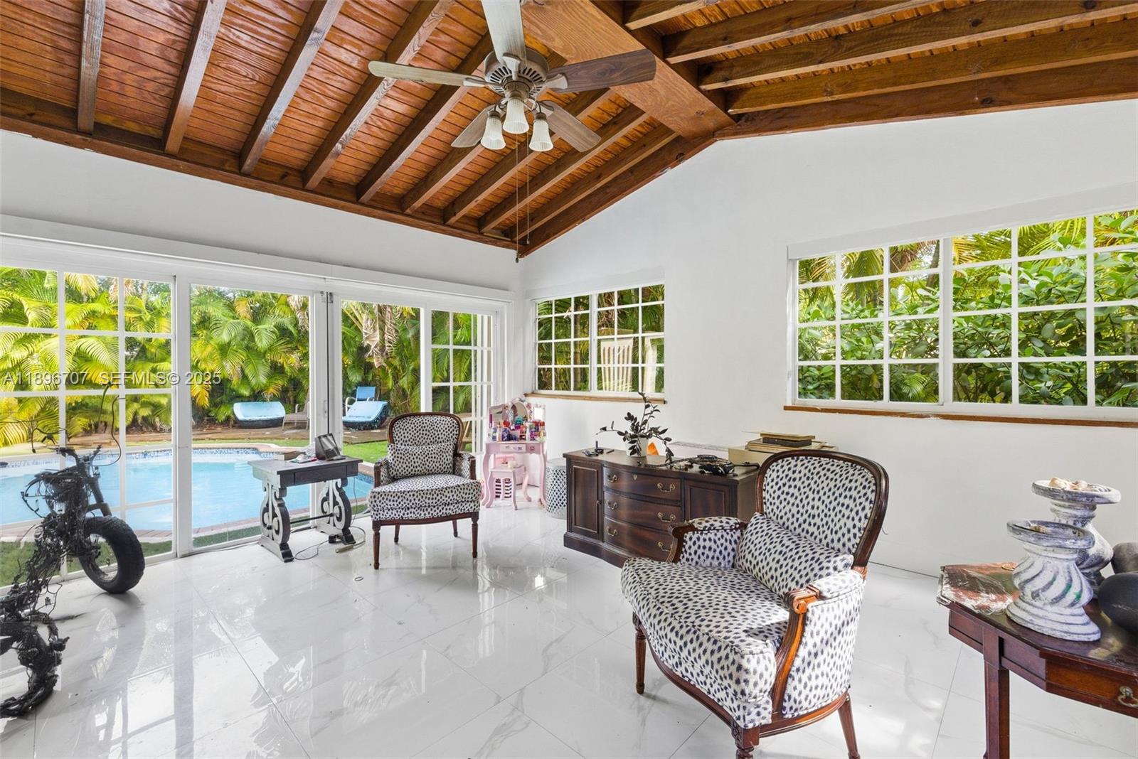401 Southwest 28th Road Miami, FL 33129 - Photo 5 of 45 a living room with furniture and large windows