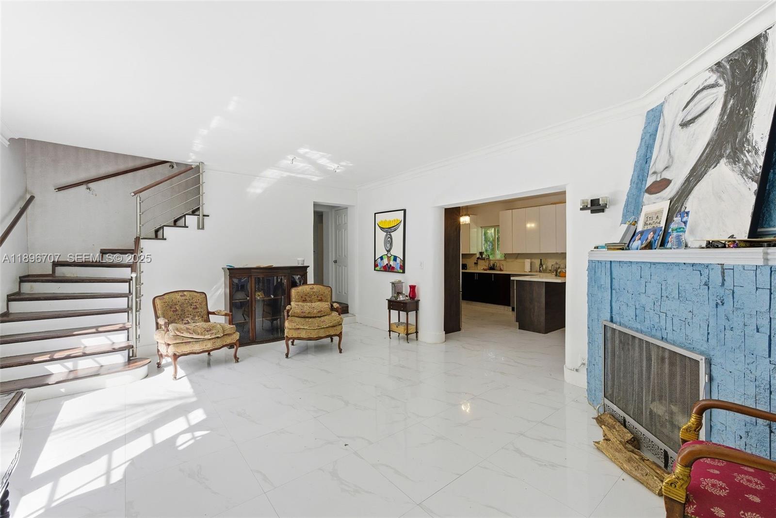 401 Southwest 28th Road Miami, FL 33129 - Photo 9 of 45 a living room with furniture and a fireplace