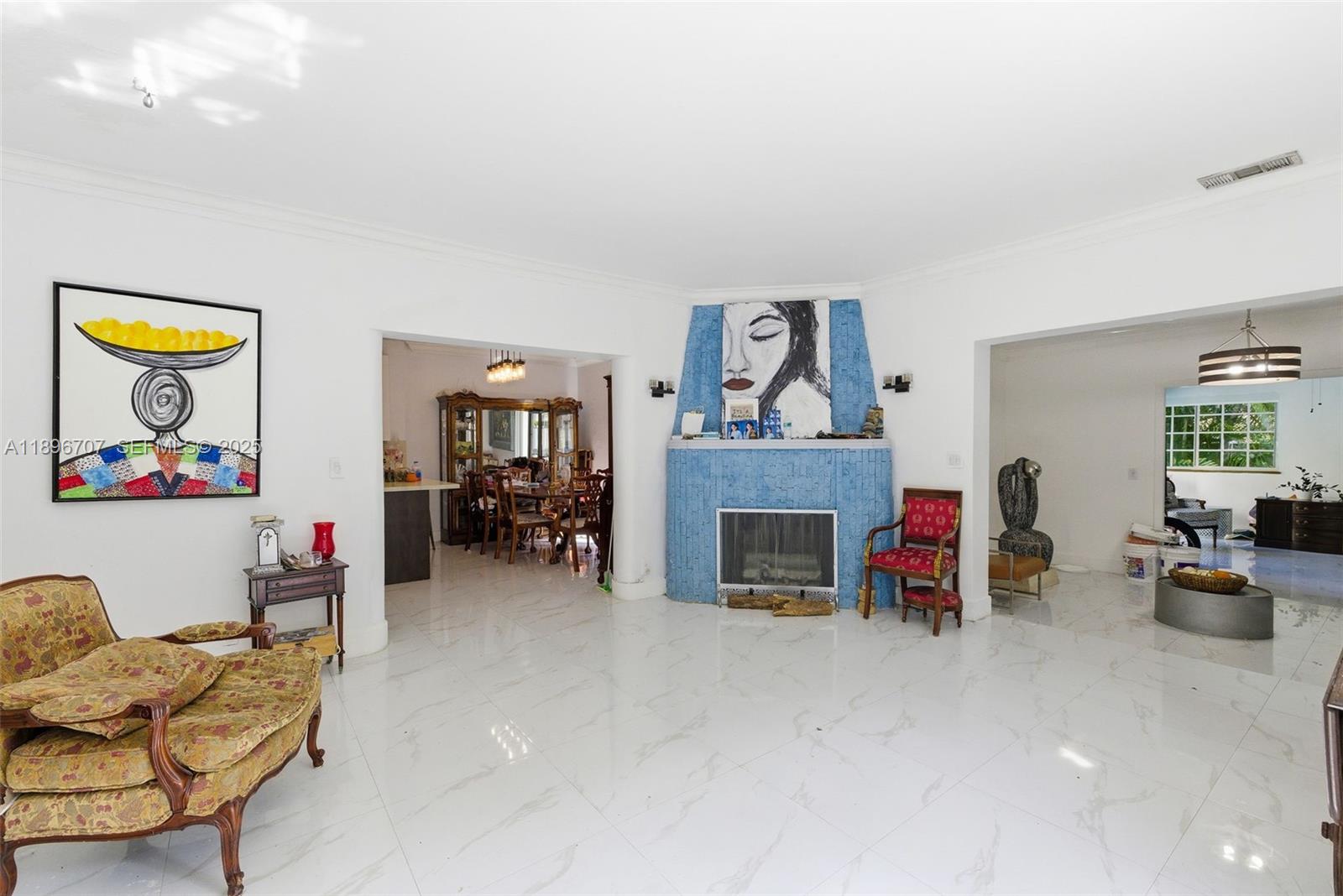 401 Southwest 28th Road Miami, FL 33129 - Photo 10 of 45 a living room with furniture and a fireplace