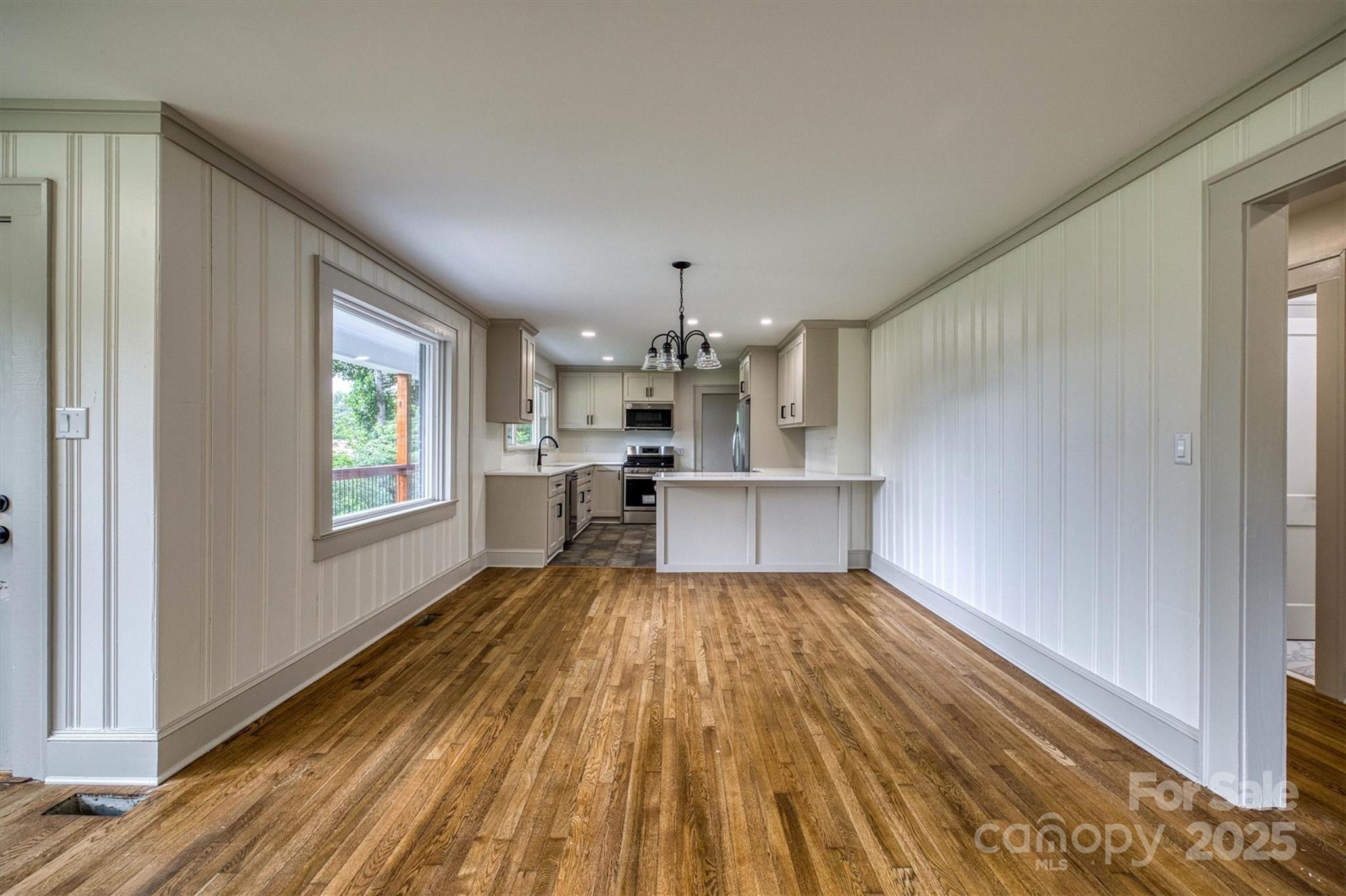 2775 Snipes Street Morganton, NC 28655 - Photo 11 of 28 a view of a kitchen with wooden floor and a window