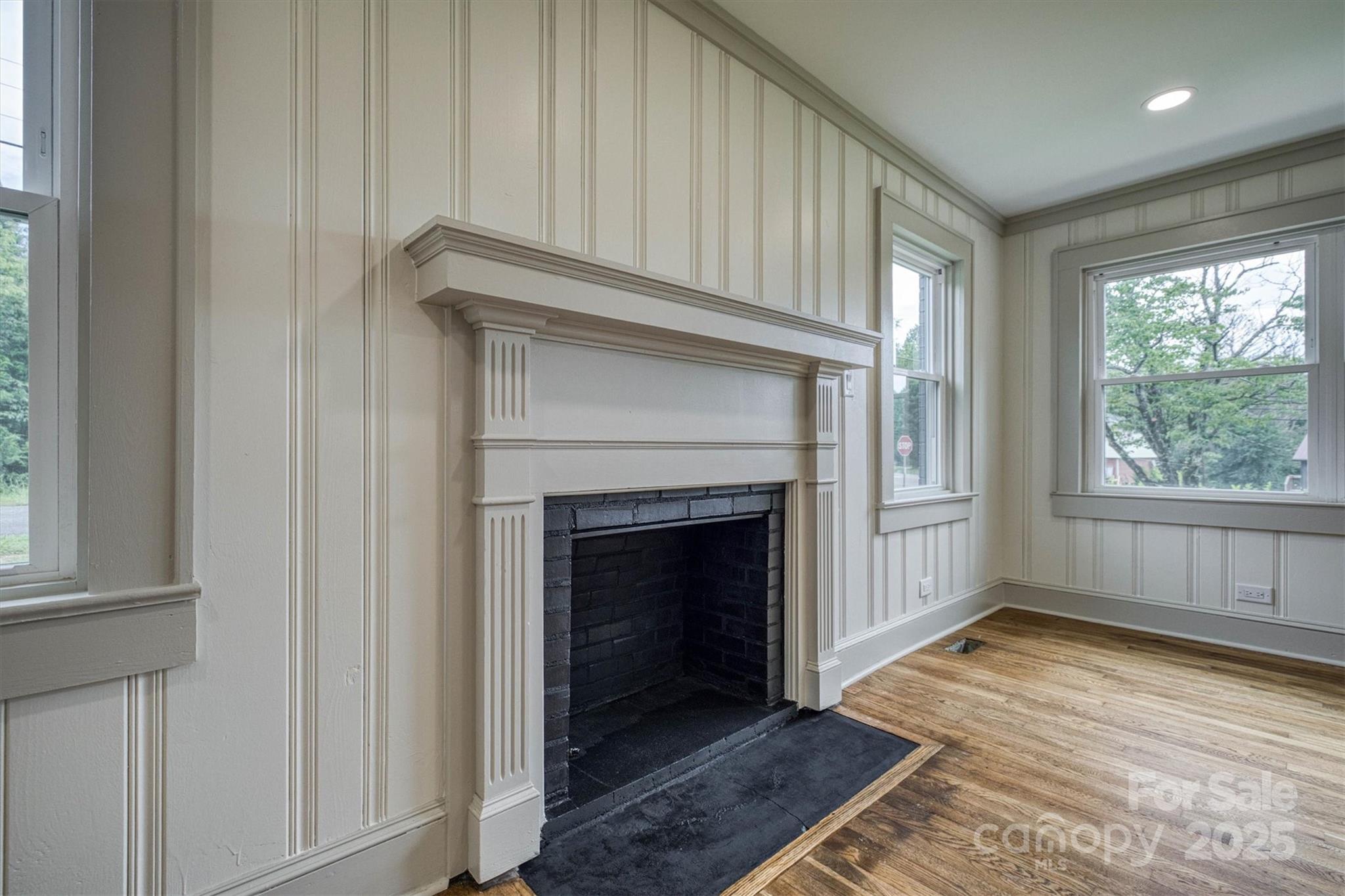 2775 Snipes Street Morganton, NC 28655 - Photo 12 of 28 a view of an empty room with wooden floor and a window