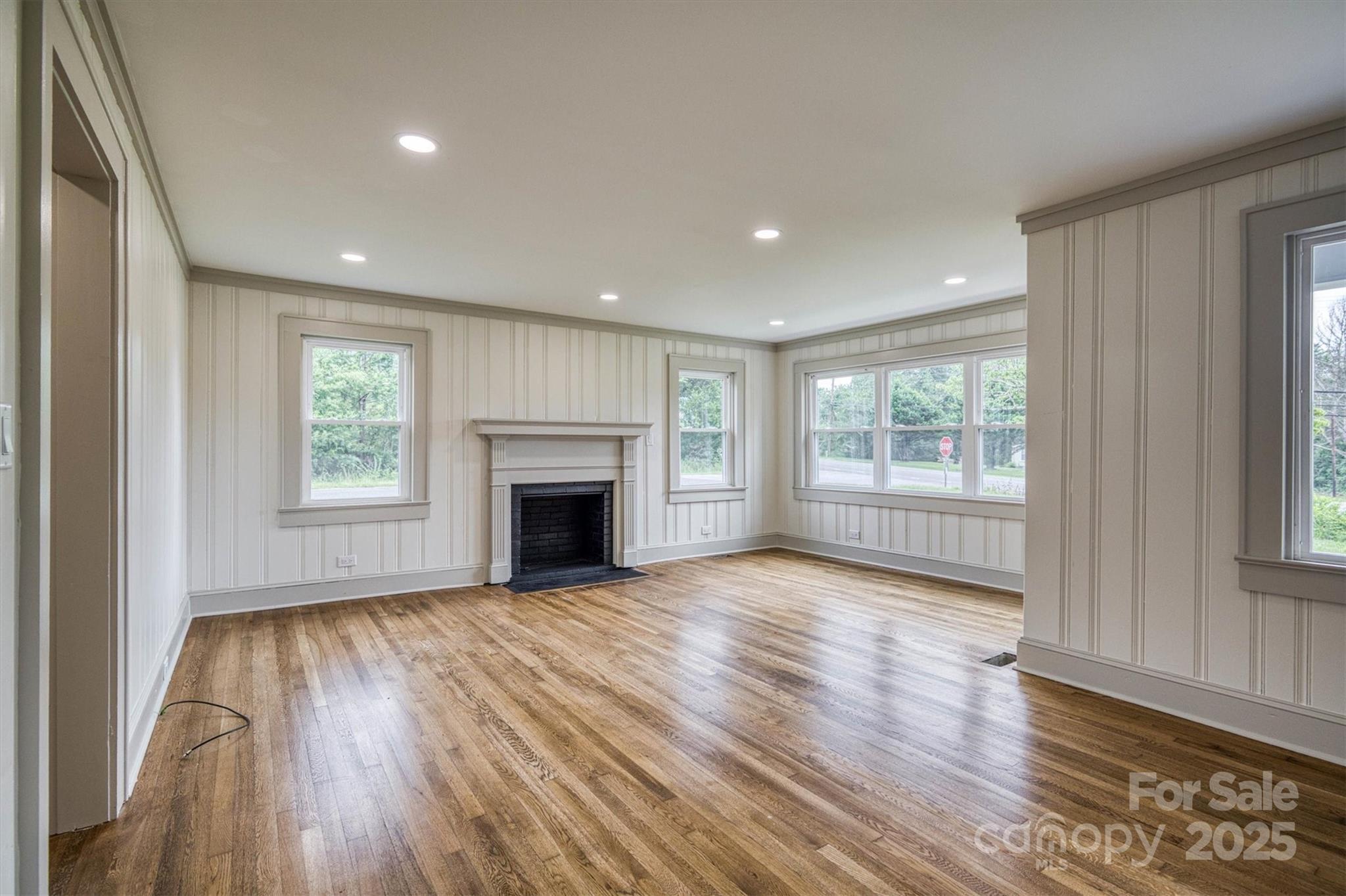 2775 Snipes Street Morganton, NC 28655 - Photo 14 of 28 a view of an empty room with wooden floor and a window