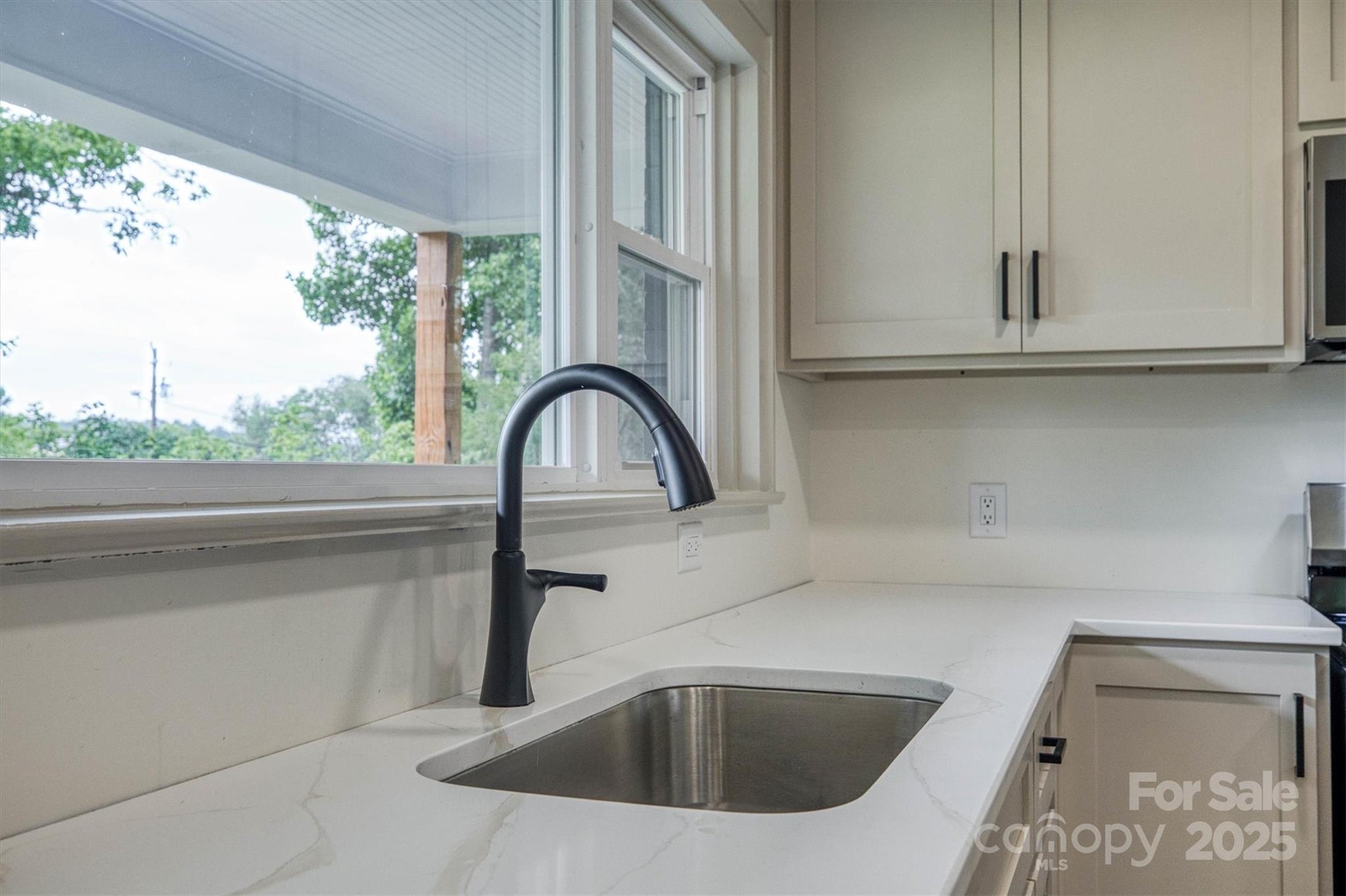 2775 Snipes Street Morganton, NC 28655 - Photo 17 of 28 a close view of sink and tap