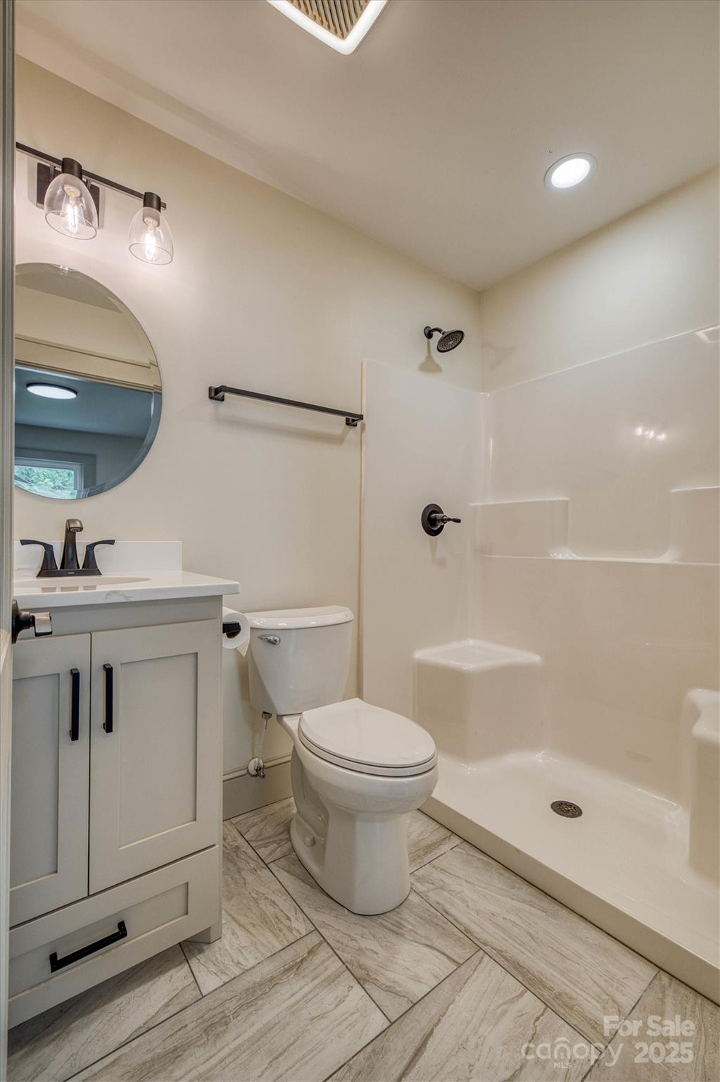 2775 Snipes Street Morganton, NC 28655 - Photo 25 of 28 a bathroom with a sink a toilet and shower