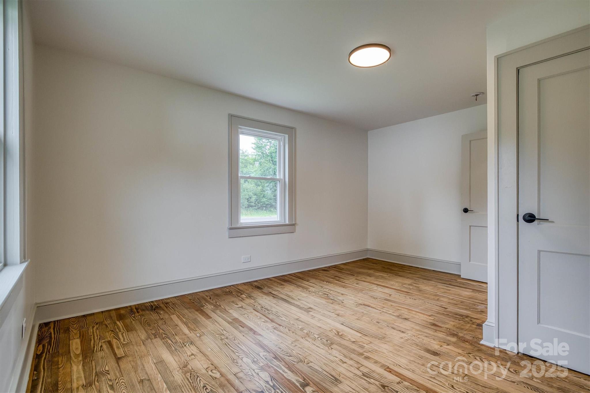 2775 Snipes Street Morganton, NC 28655 - Photo 26 of 28 wooden floor in an empty room with a window