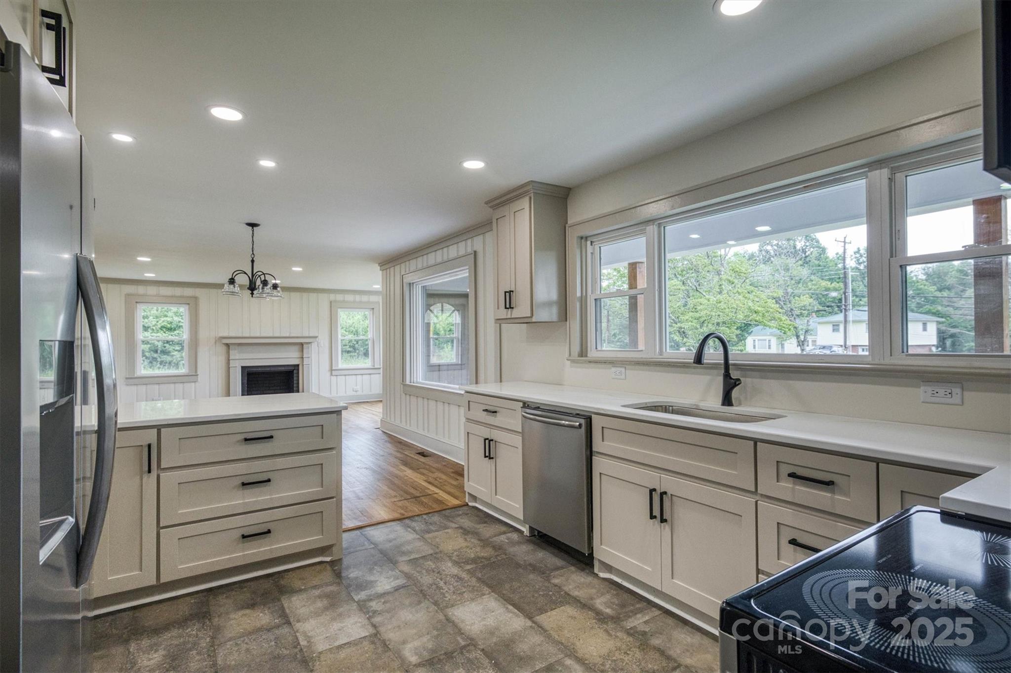 2775 Snipes Street Morganton, NC 28655 - Photo 5 of 28 a kitchen with a sink stove and microwave