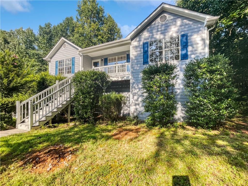 129 Michelle Lane Hiram, GA 30141 - Photo 1 of 1 a front view of house with yard and green space