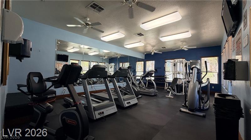 7255 West Sunset Road, Unit 2027 Las Vegas, NV 89113 - Photo 34 of 38 Mirrored walls and recessed lighting elevate this dedicated fitness space.