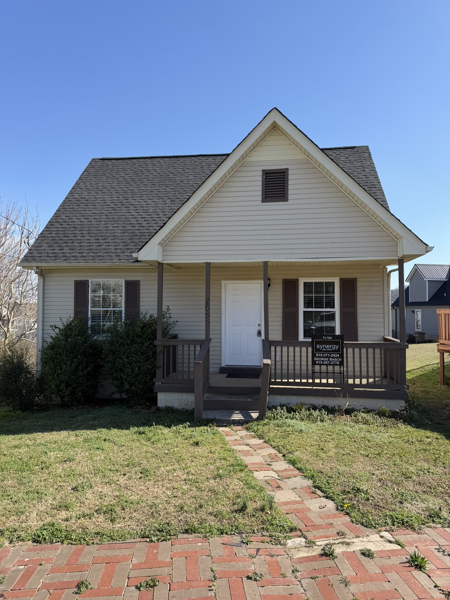 front view of a house with a yard