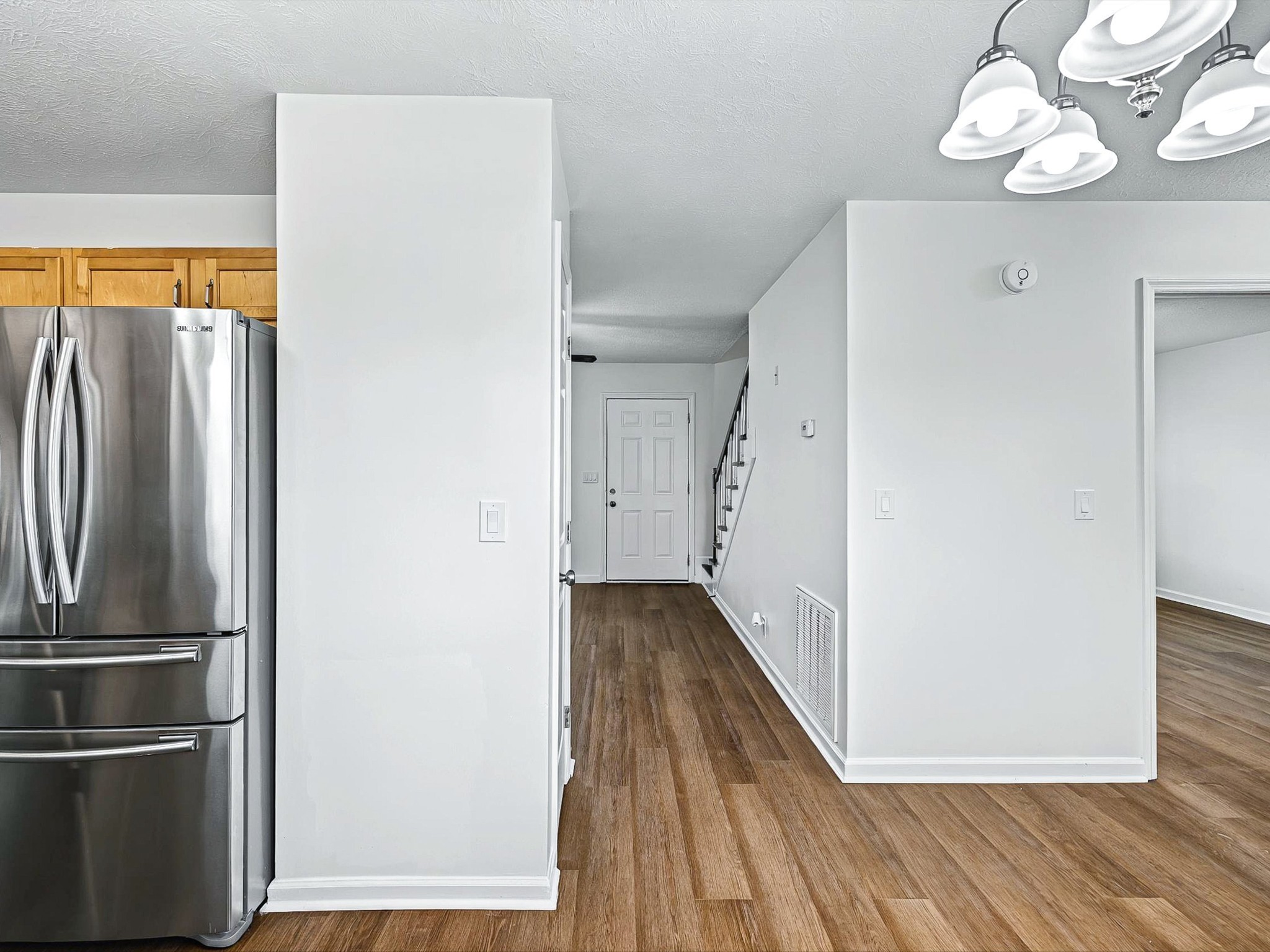 2688 Pine Ridge Drive Nashville, TN 37207 - Photo 12 of 39 a view of a kitchen with wooden floor and a refrigerator