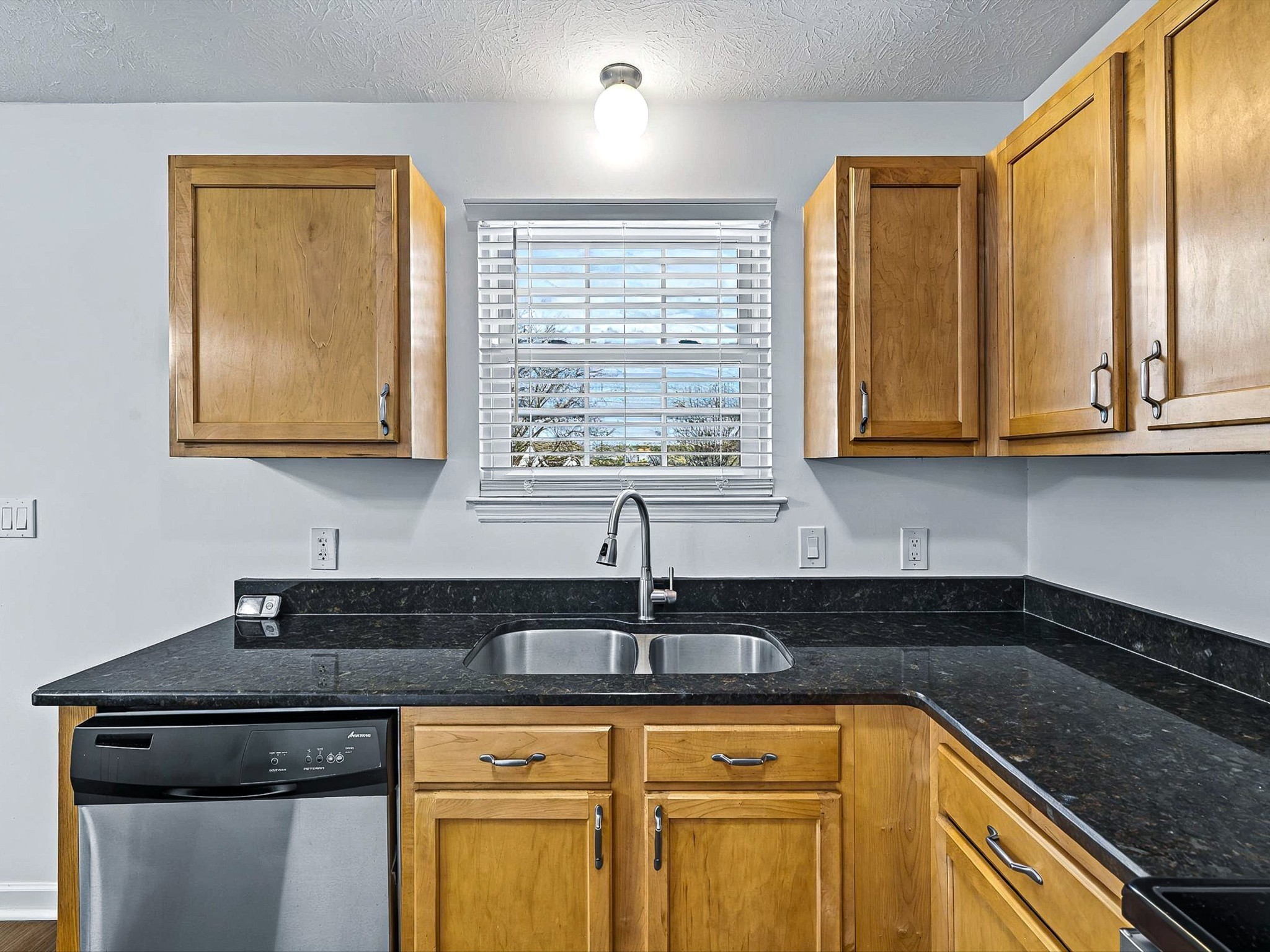 2688 Pine Ridge Drive Nashville, TN 37207 - Photo 13 of 39 a kitchen with granite countertop a sink a stove and cabinets