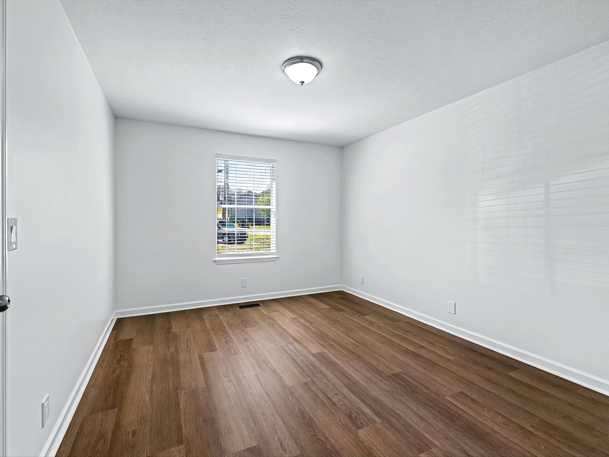 2688 Pine Ridge Drive Nashville, TN 37207 - Photo 16 of 39 an empty room with wooden floor and windows