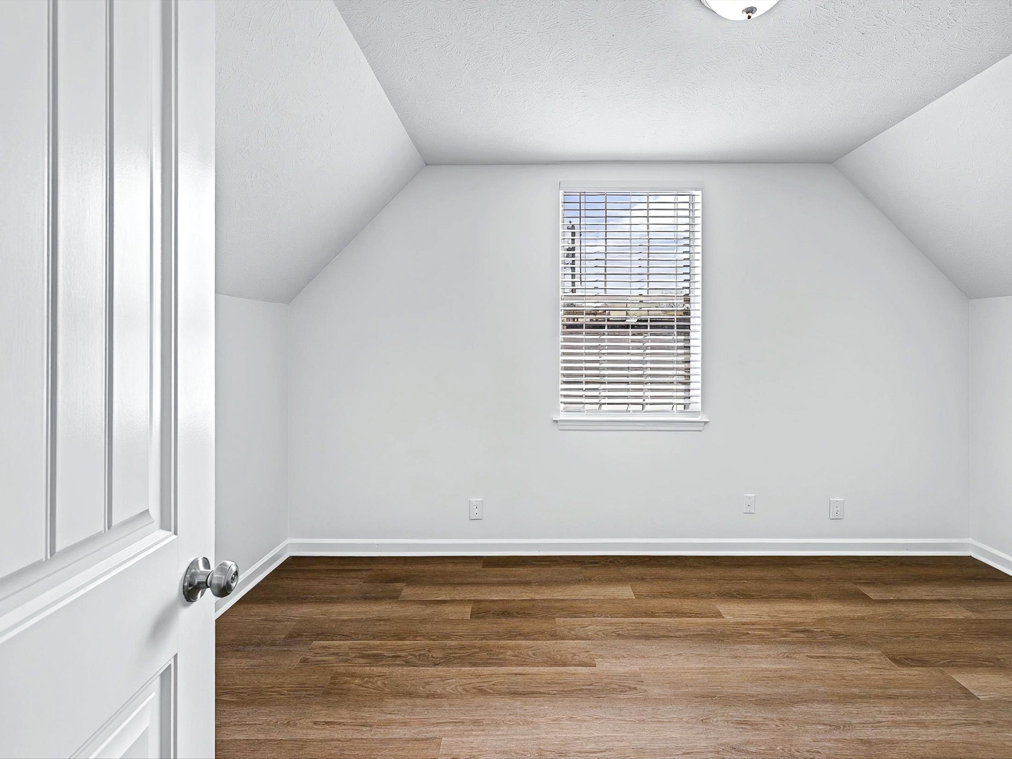 2688 Pine Ridge Drive Nashville, TN 37207 - Photo 20 of 39 a view of an empty room with wooden floor and a window