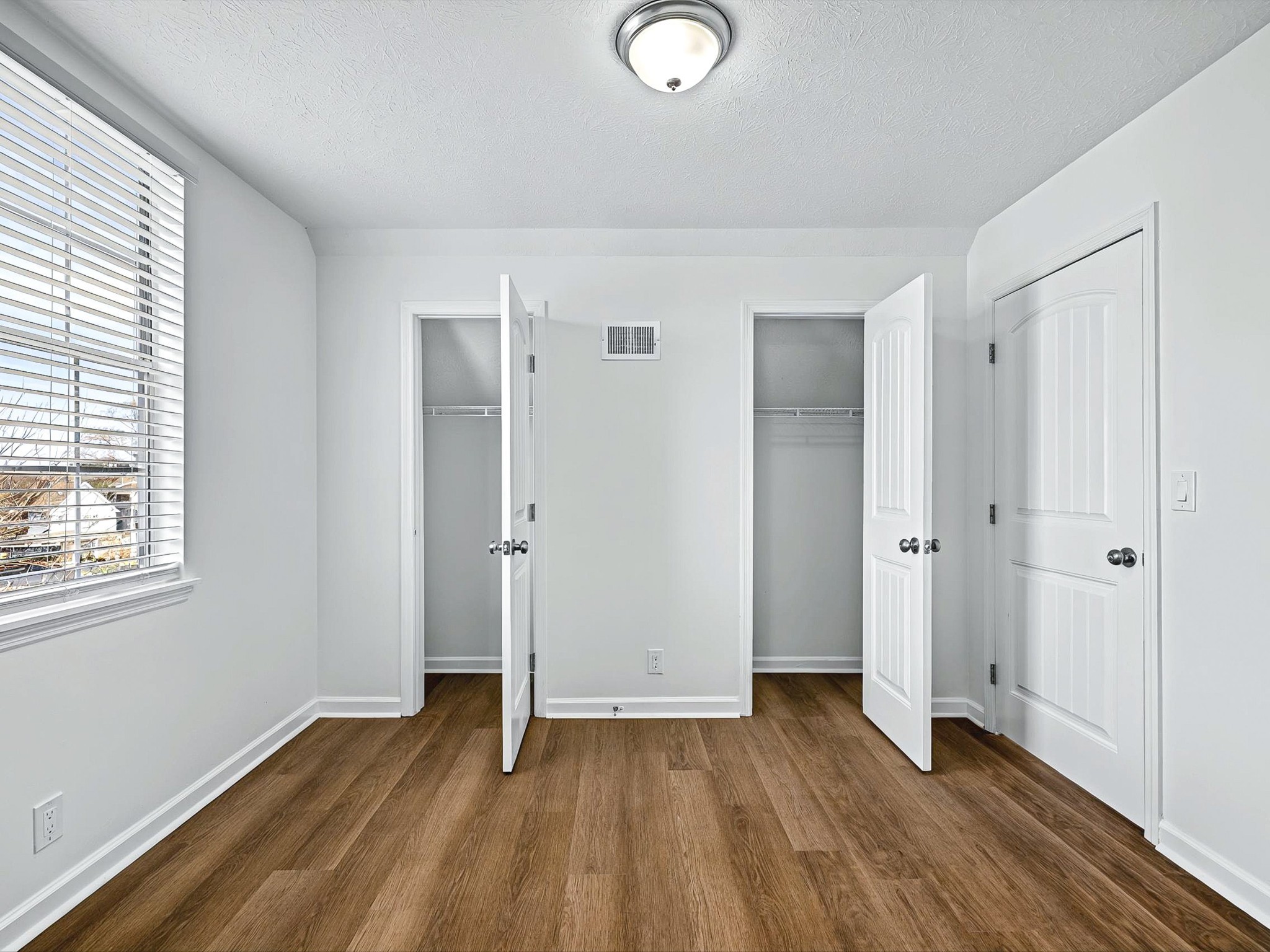 2688 Pine Ridge Drive Nashville, TN 37207 - Photo 25 of 39 an empty room with wooden floor and windows