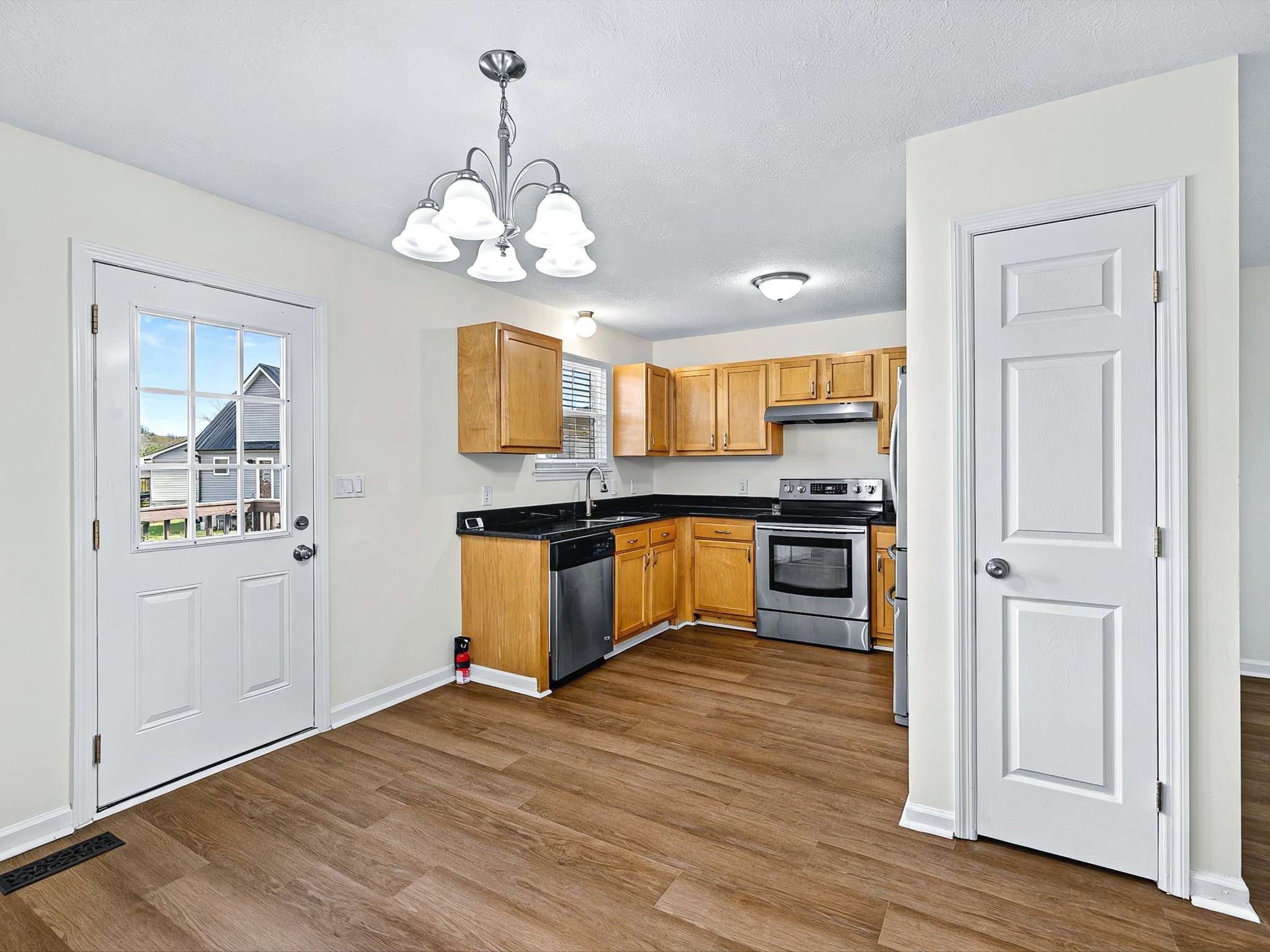 2688 Pine Ridge Drive Nashville, TN 37207 - Photo 7 of 39 a large kitchen with granite countertop a stove and cabinets