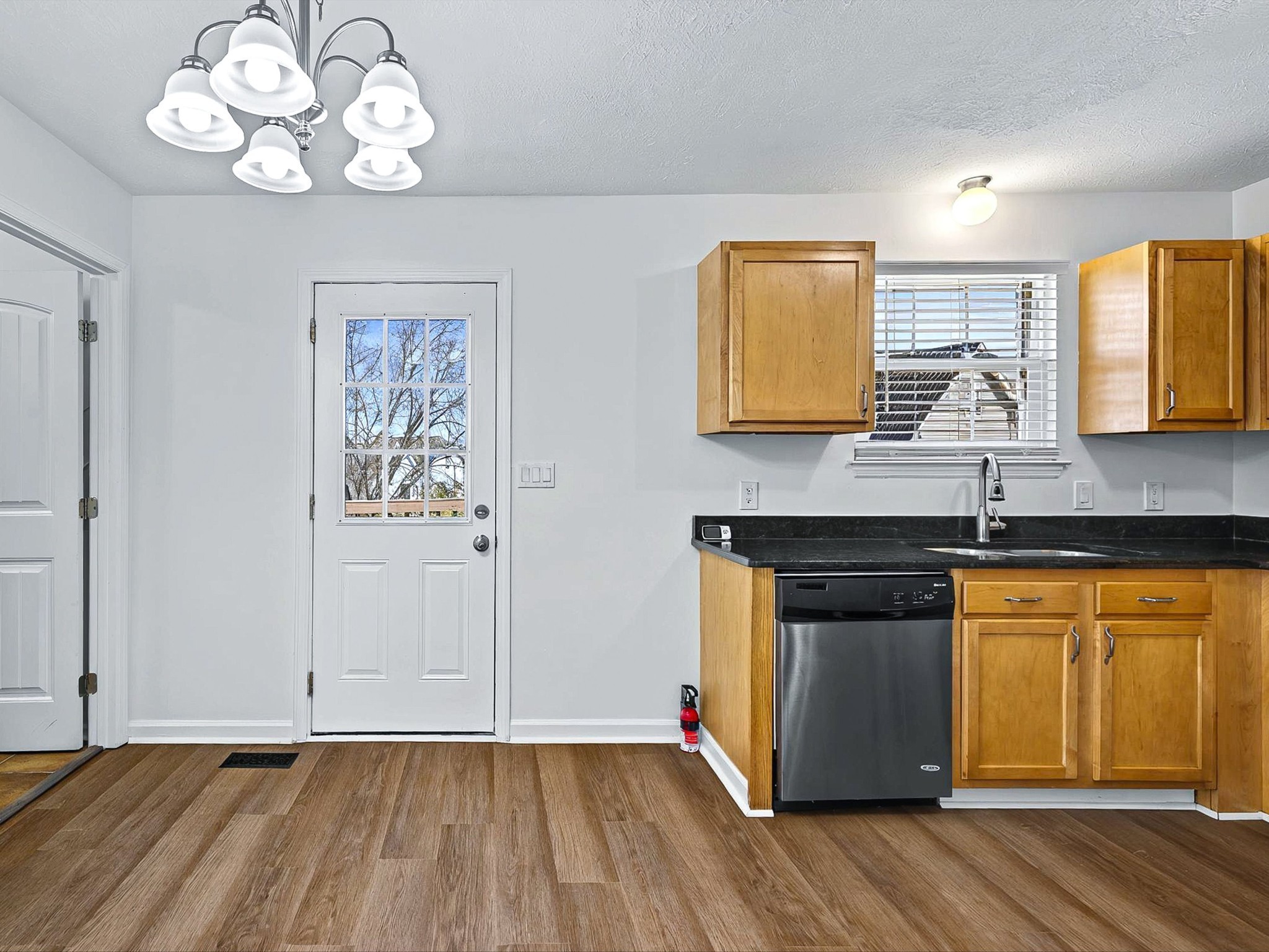 2688 Pine Ridge Drive Nashville, TN 37207 - Photo 8 of 39 a kitchen with granite countertop wooden floors and wide window