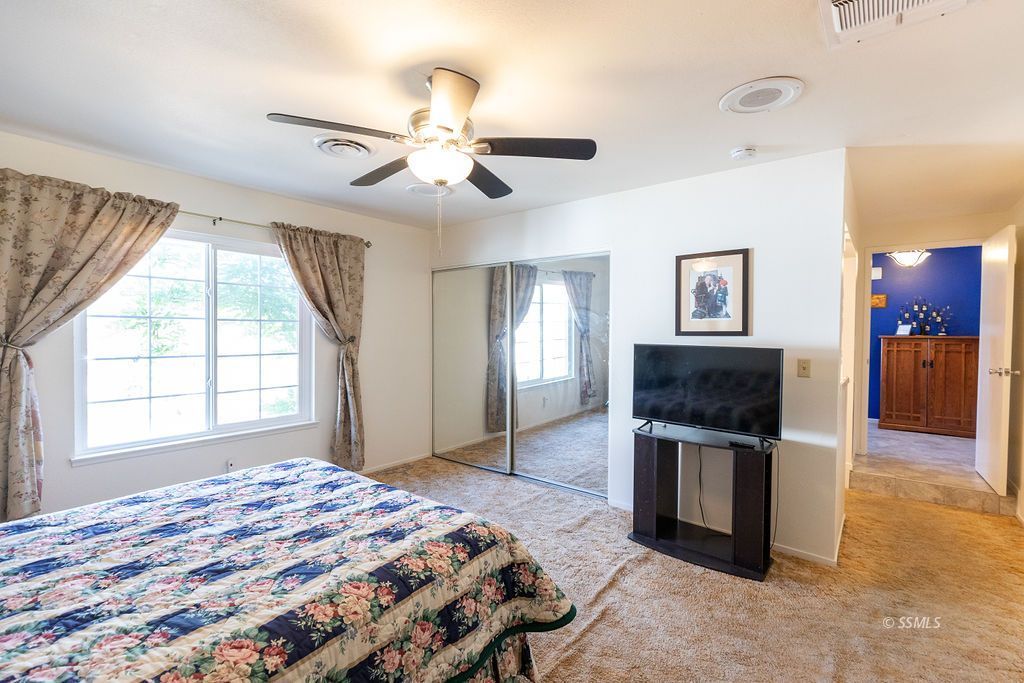 737 Scott Circle Ridgecrest, CA 93555 - Photo 35 of 49 a bedroom with a bed and a television