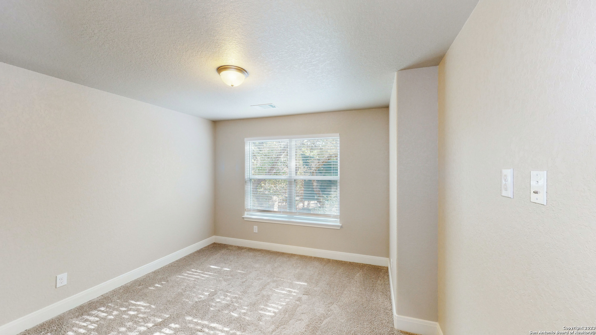 146 Magnolia Circle Boerne, TX 78006 - Photo 3 of 20 a view of an empty room with a window