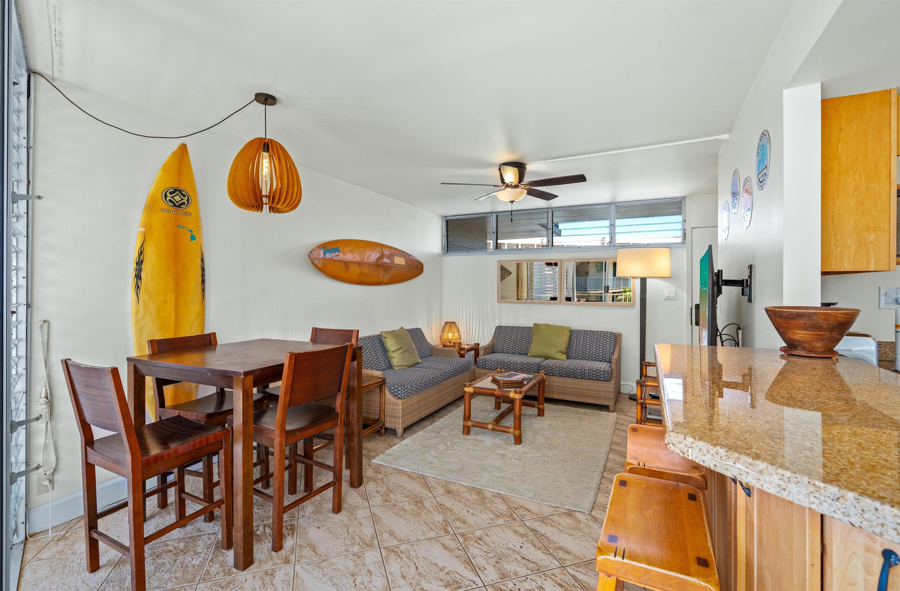 2450 South Kihei Road, Unit 301 Kihei, HI 96753 - Photo 11 of 35 a living room with furniture and a large window