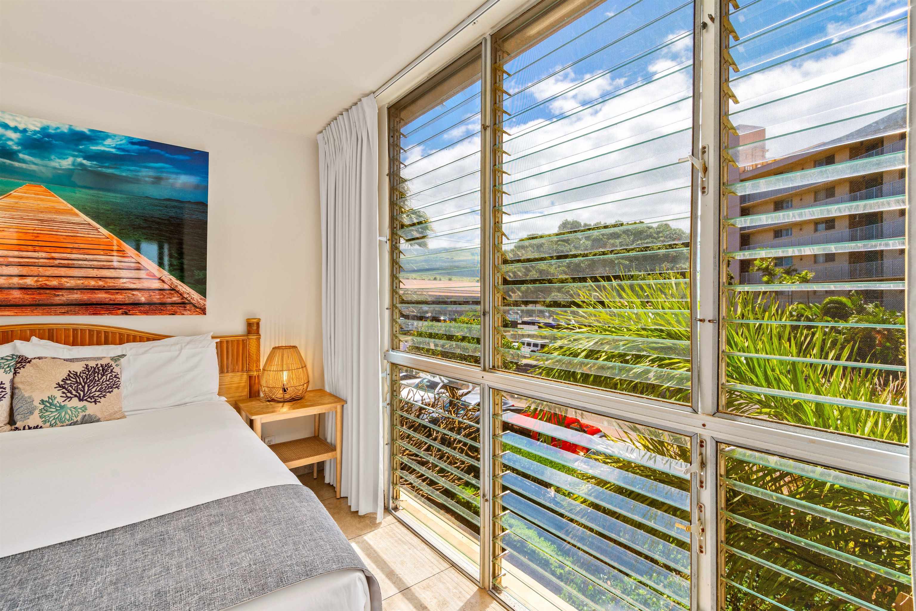 2450 South Kihei Road, Unit 301 Kihei, HI 96753 - Photo 14 of 35 a view of a balcony and floor to ceiling windows