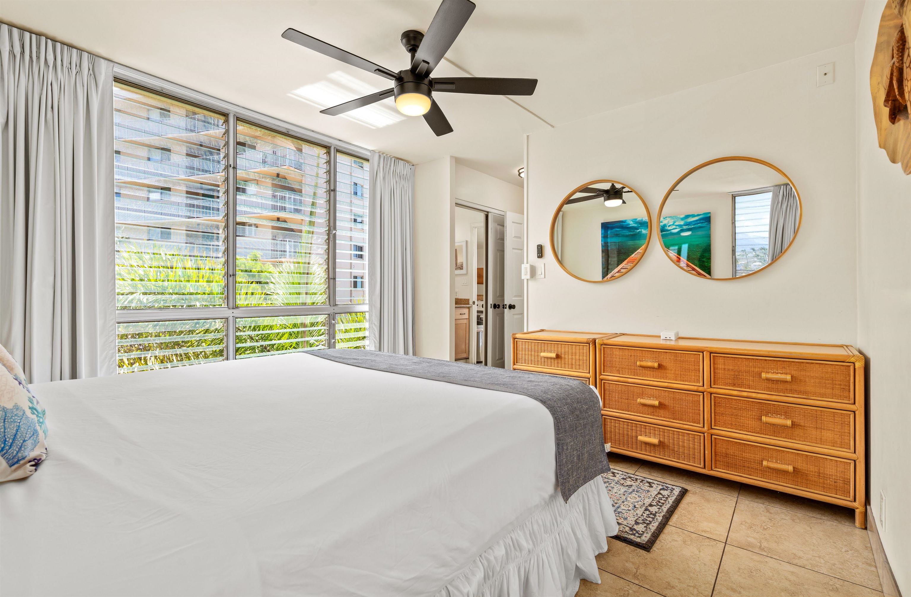 2450 South Kihei Road, Unit 301 Kihei, HI 96753 - Photo 16 of 35 a bedroom with a bed dresser and a window