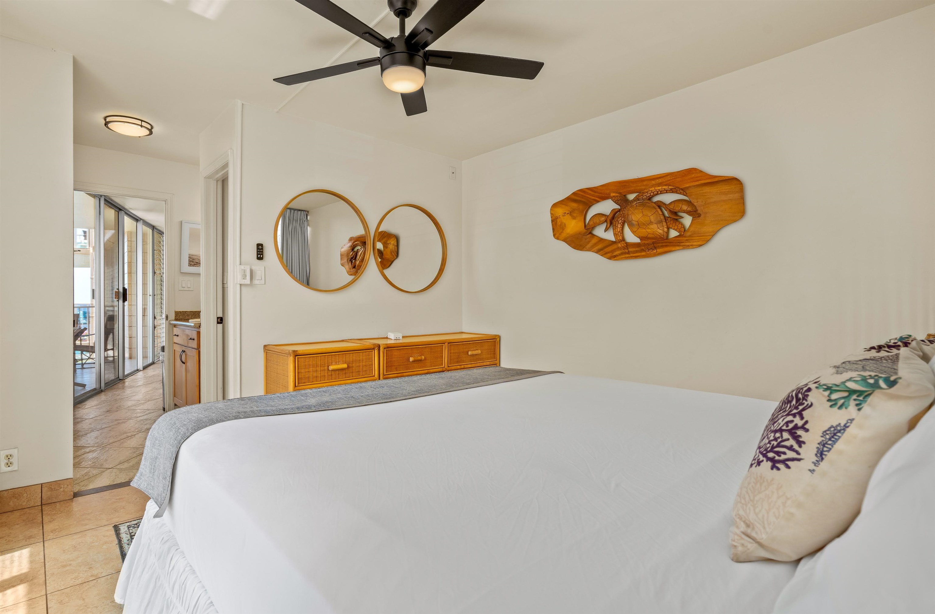 2450 South Kihei Road, Unit 301 Kihei, HI 96753 - Photo 17 of 35 a view of a bedroom with a bed