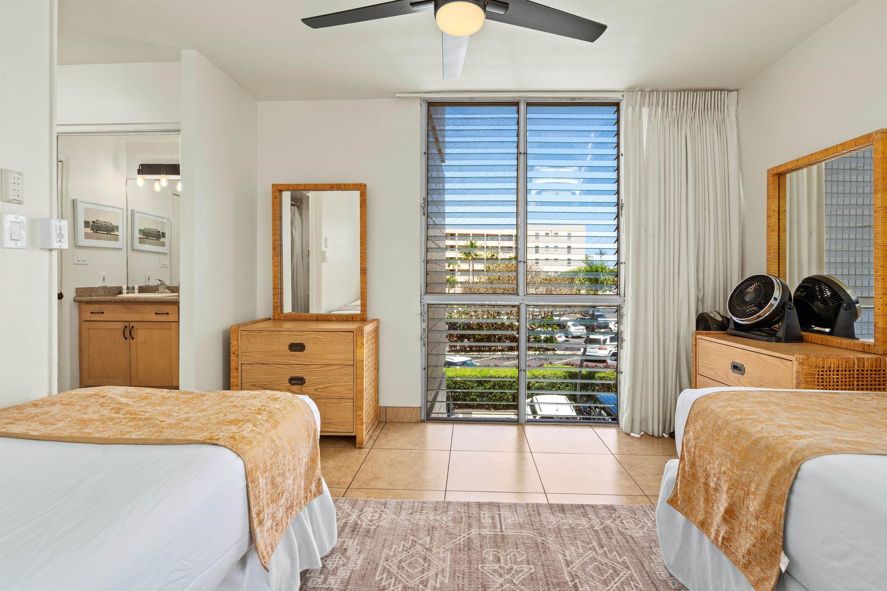 2450 South Kihei Road, Unit 301 Kihei, HI 96753 - Photo 21 of 35 a bedroom with a bed and large windows