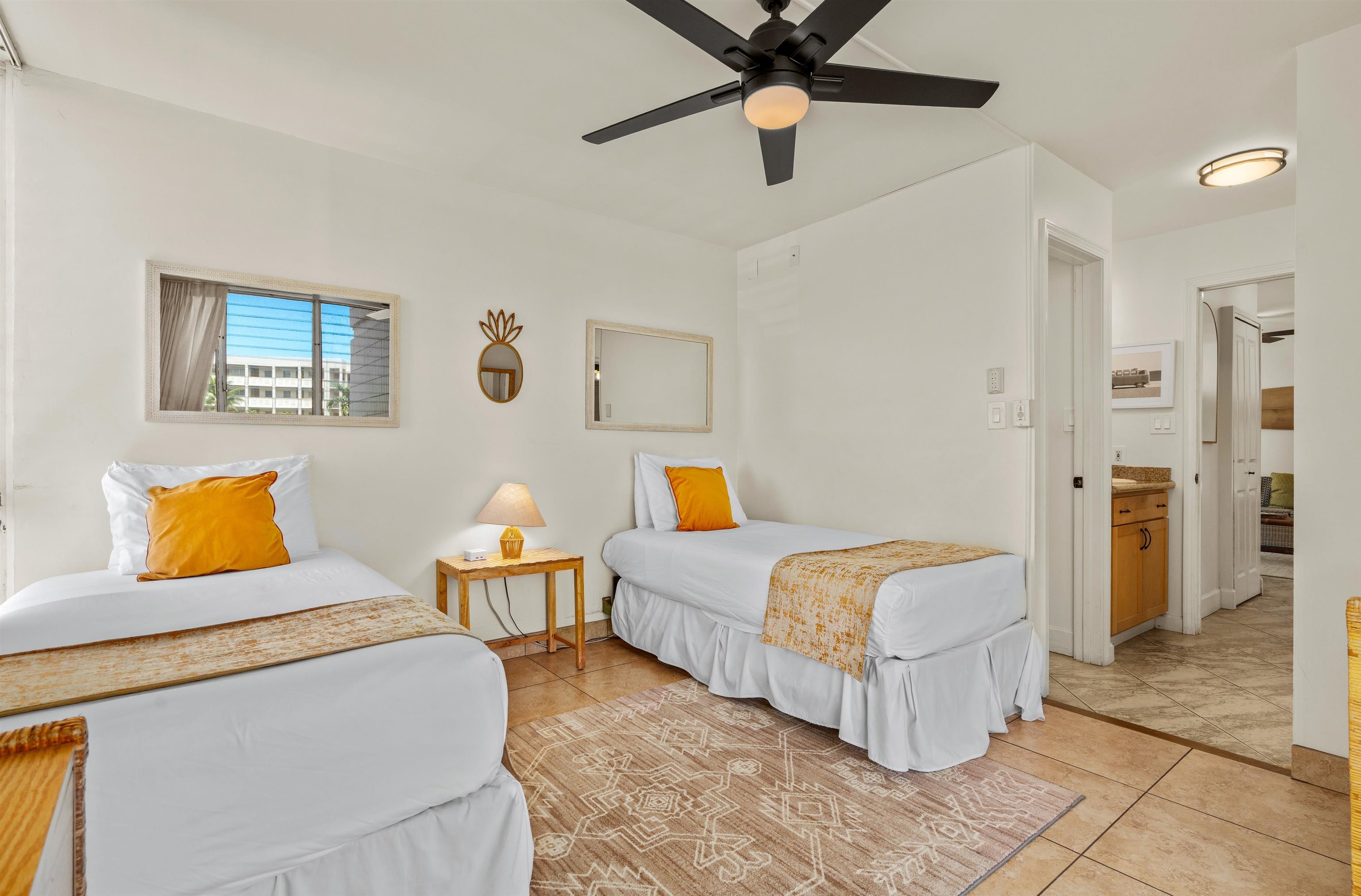 2450 South Kihei Road, Unit 301 Kihei, HI 96753 - Photo 23 of 35 a bedroom with a bed and lamp