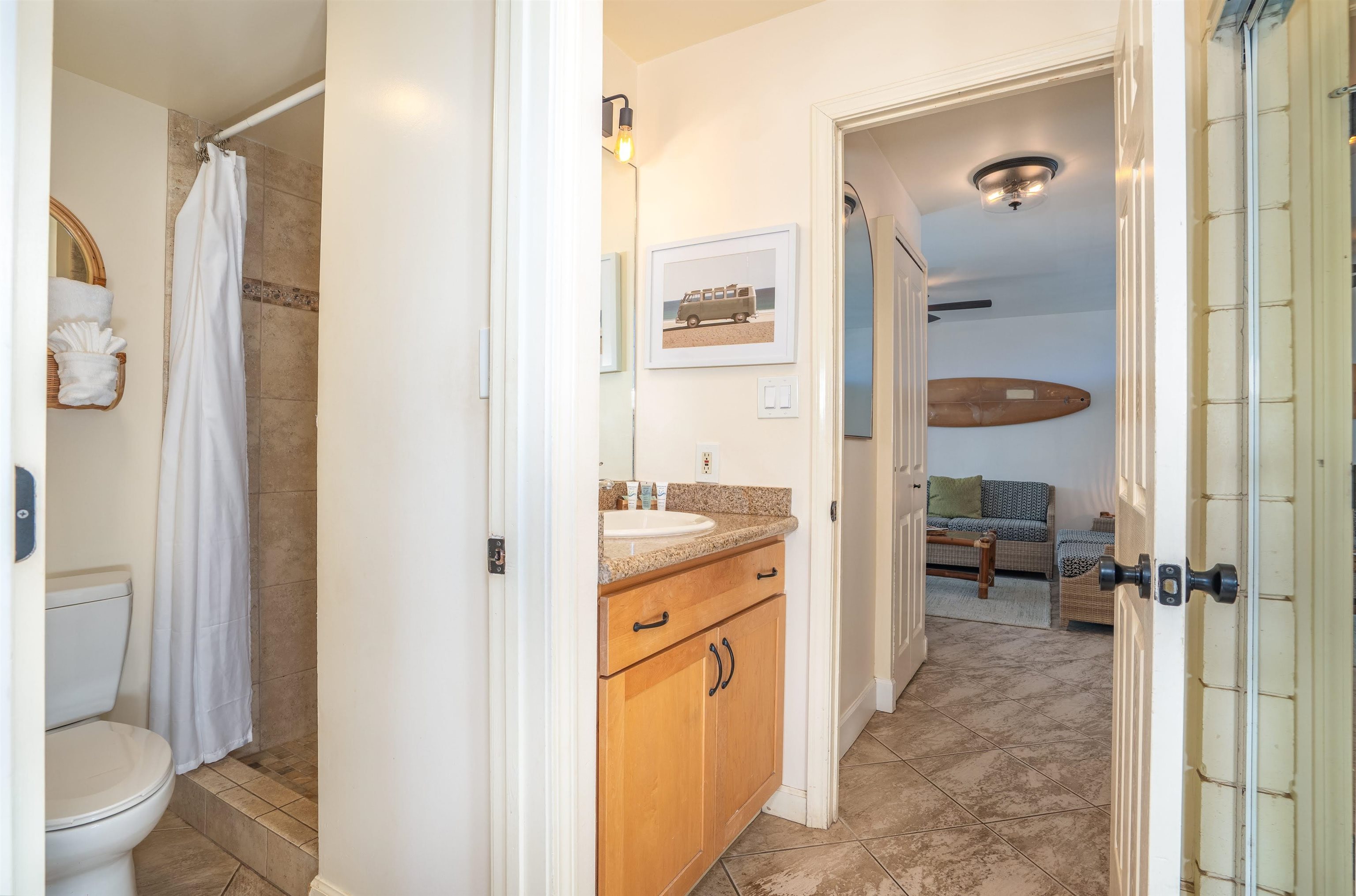 2450 South Kihei Road, Unit 301 Kihei, HI 96753 - Photo 24 of 35 a bathroom with a granite countertop sink a mirror and a shower