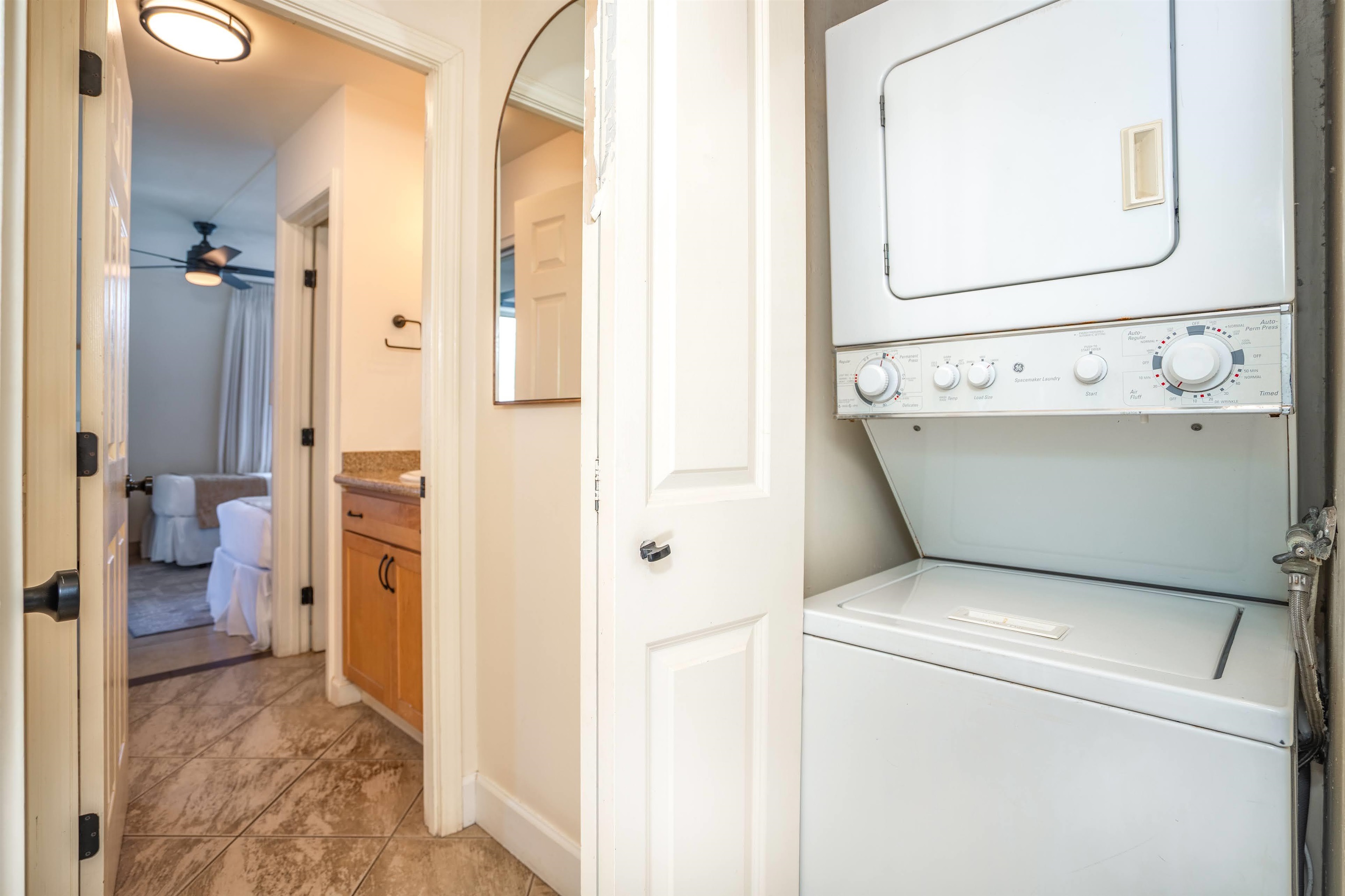 2450 South Kihei Road, Unit 301 Kihei, HI 96753 - Photo 27 of 35 a view of bathroom with a sink and a mirror