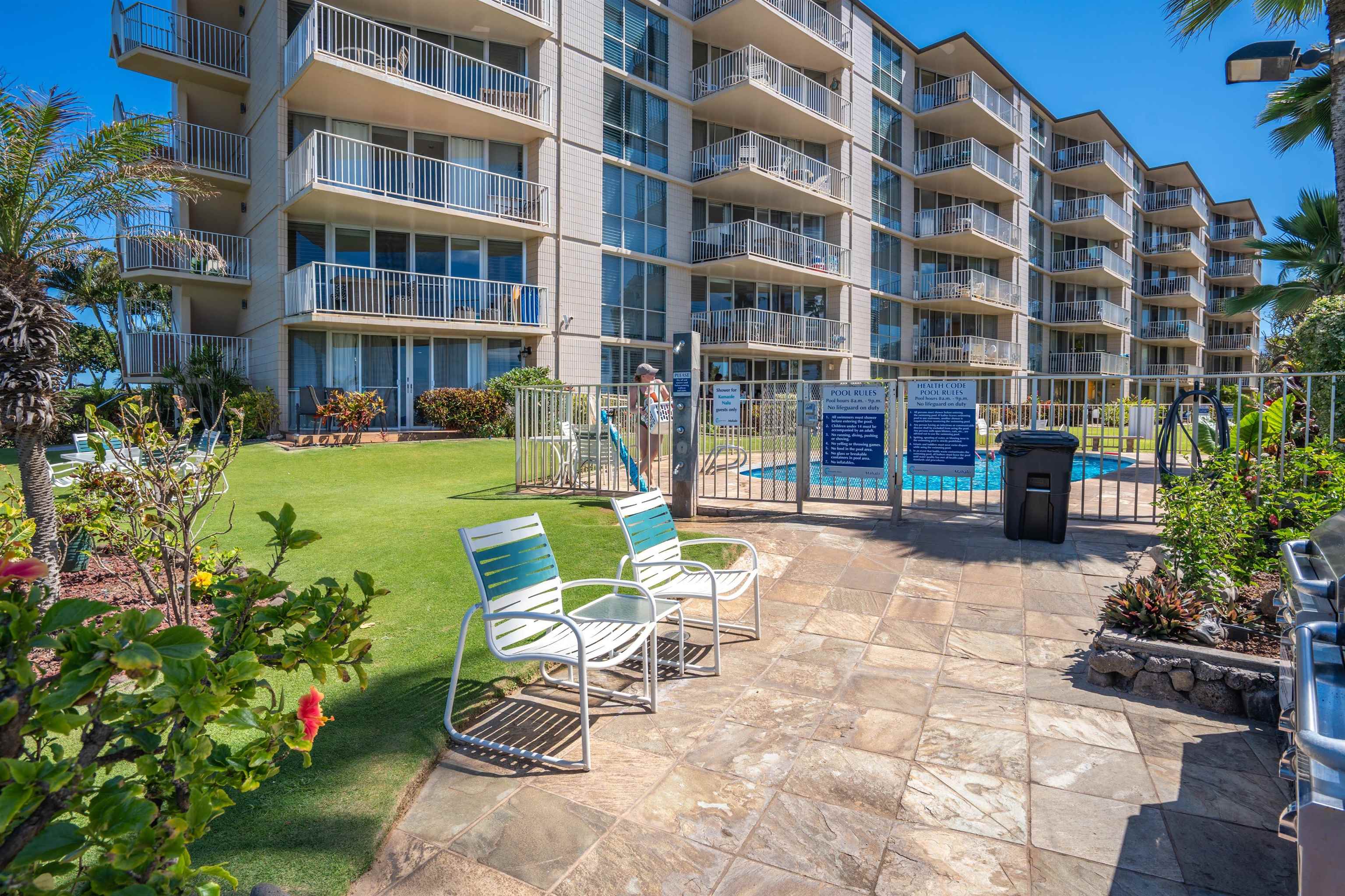 2450 South Kihei Road, Unit 301 Kihei, HI 96753 - Photo 29 of 35 a view of a building with a yard