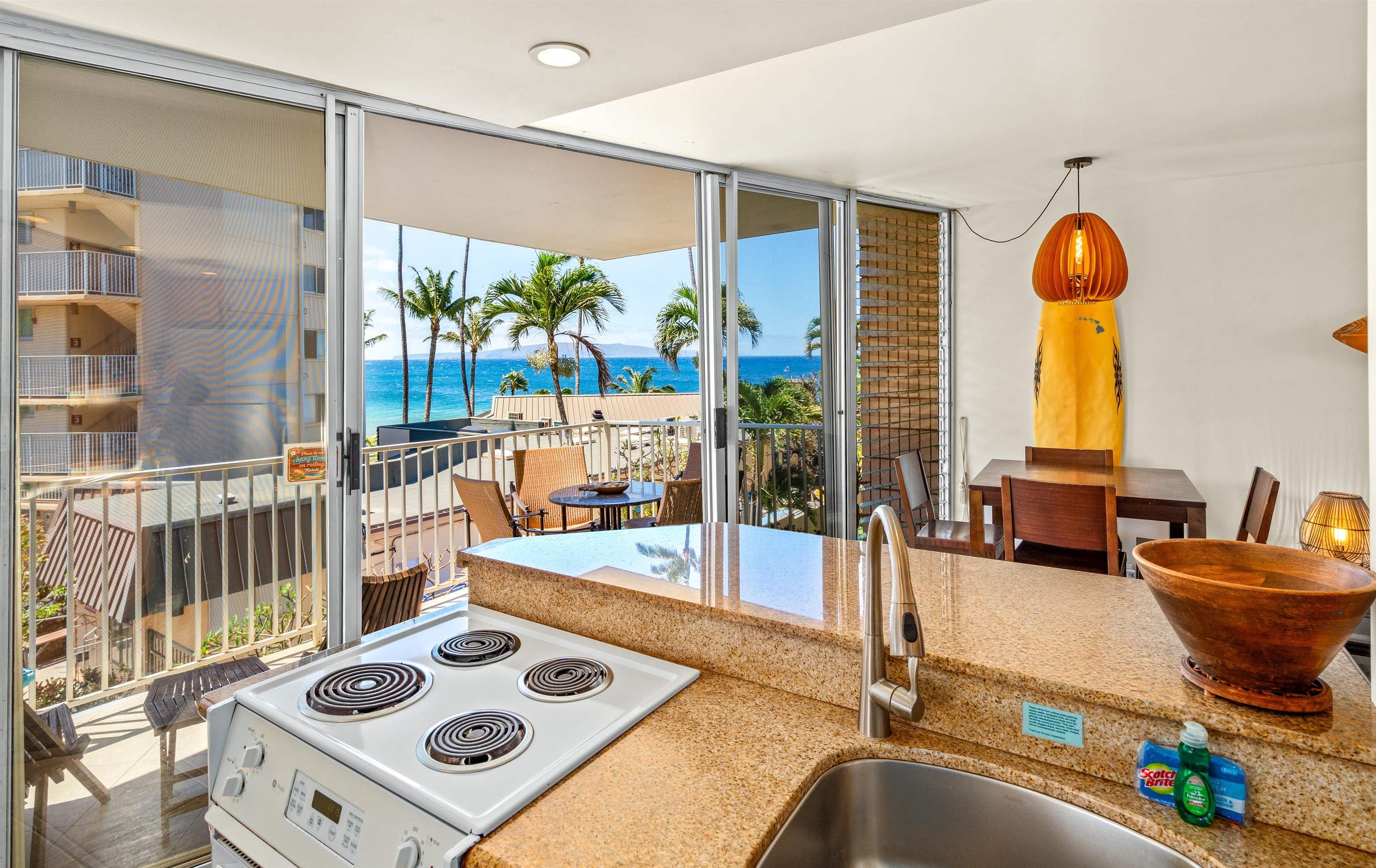 2450 South Kihei Road, Unit 301 Kihei, HI 96753 - Photo 6 of 35 a living room with furniture and a table
