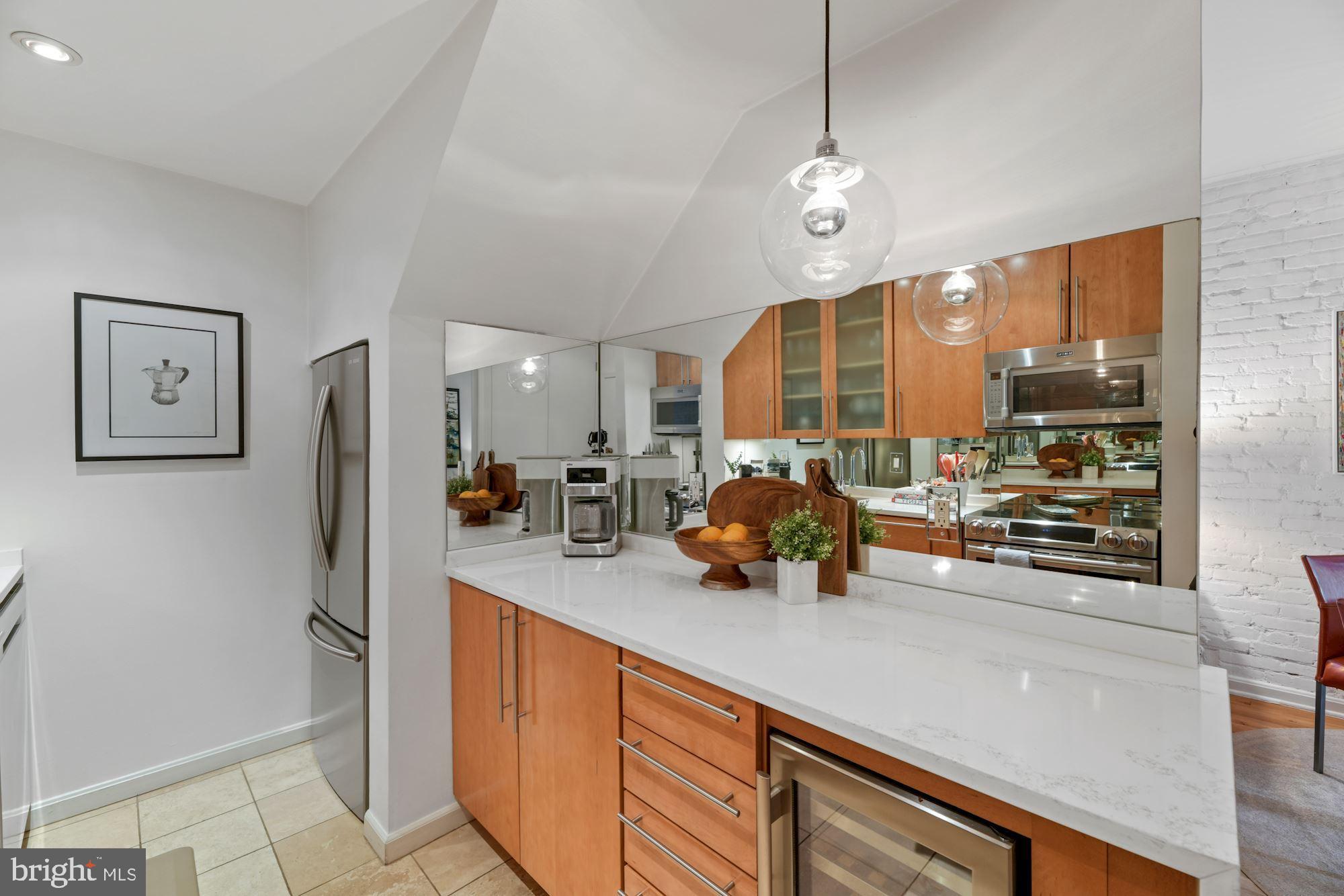 1822 T Street Northwest, Unit 3 Washington, DC 20009 - Photo 5 of 22 W/ Quartz Waterfall Countertops & SS Appliances
