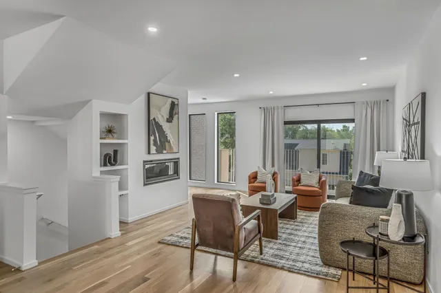 a dining room with furniture and wooden floor