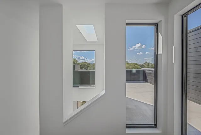 a picture of a bathroom with a glass door