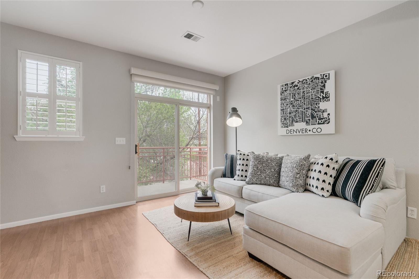5392 Allison Street Arvada, CO 80002 - Photo 11 of 47 a living room with furniture and a large window