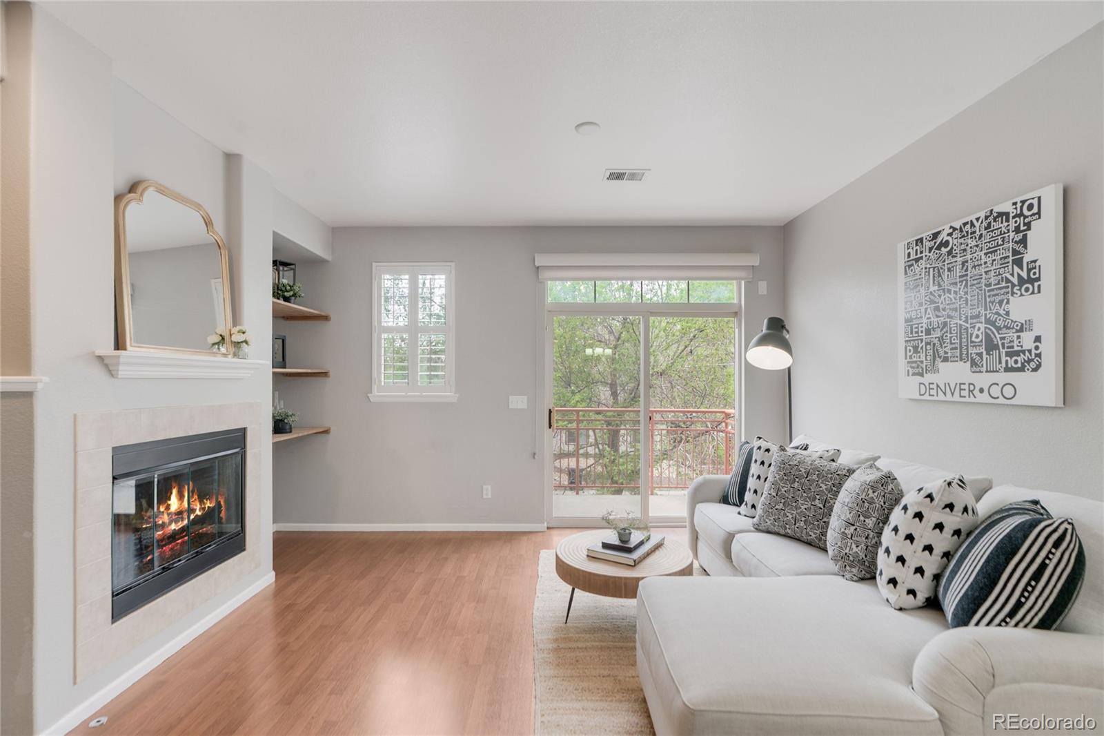 5392 Allison Street Arvada, CO 80002 - Photo 12 of 47 a living room with furniture and a fireplace