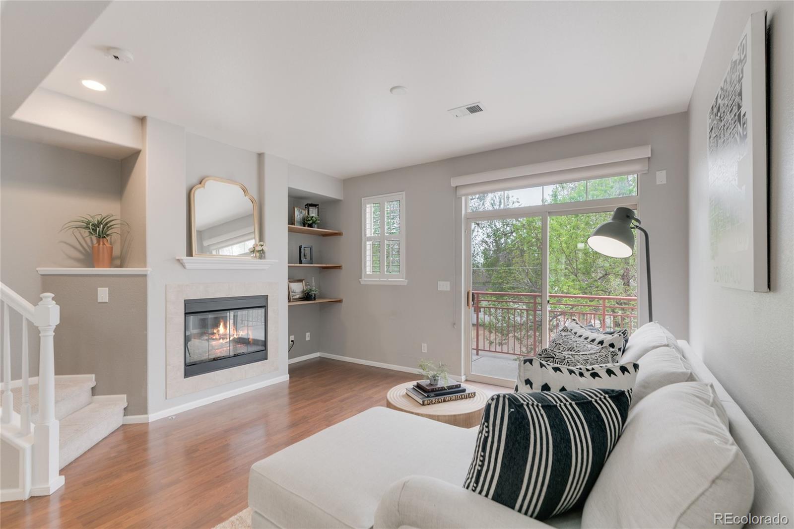 5392 Allison Street Arvada, CO 80002 - Photo 14 of 47 a spacious bedroom with a bed and wooden floor