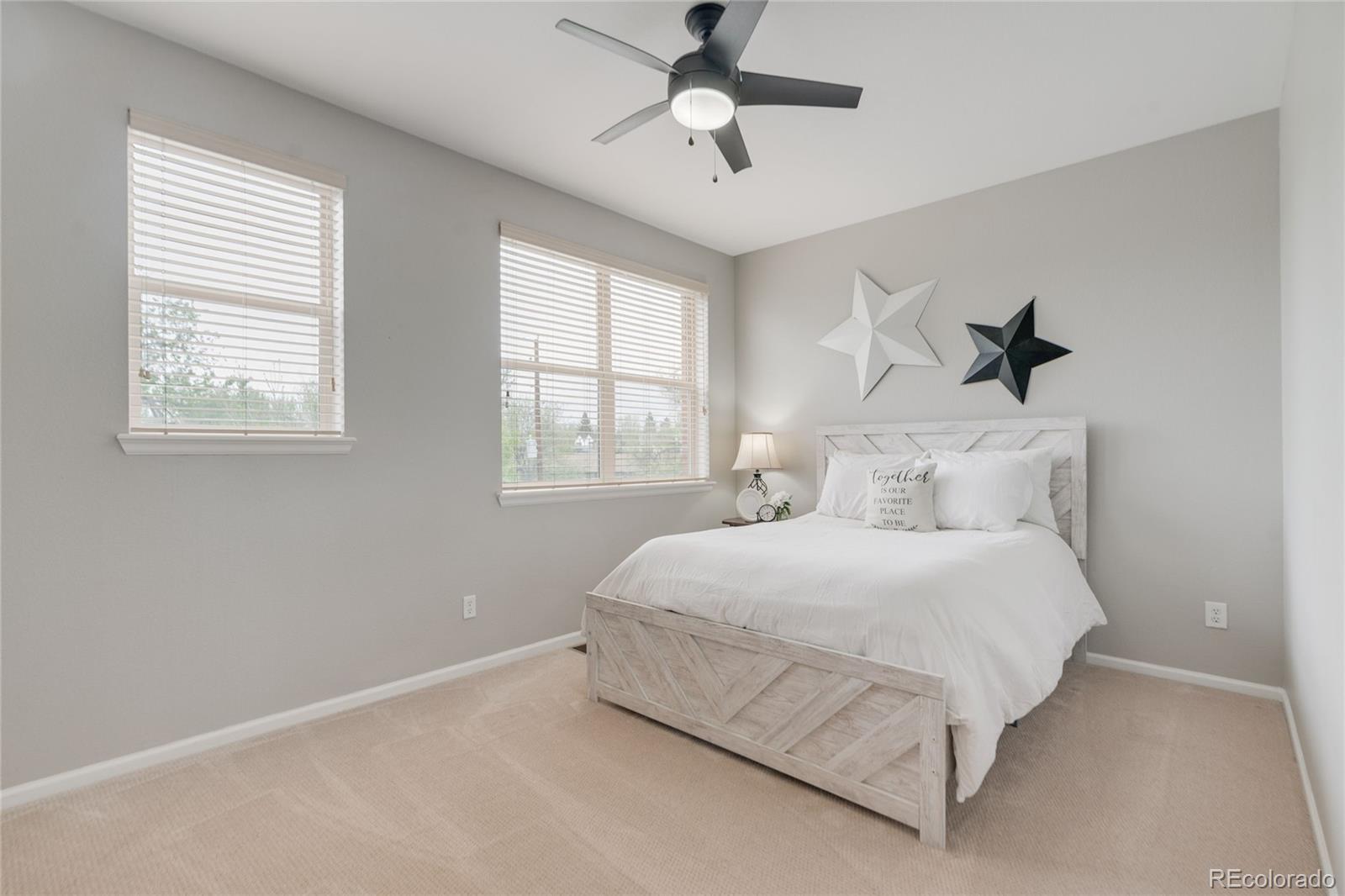 5392 Allison Street Arvada, CO 80002 - Photo 16 of 47 a bedroom with a bed and window